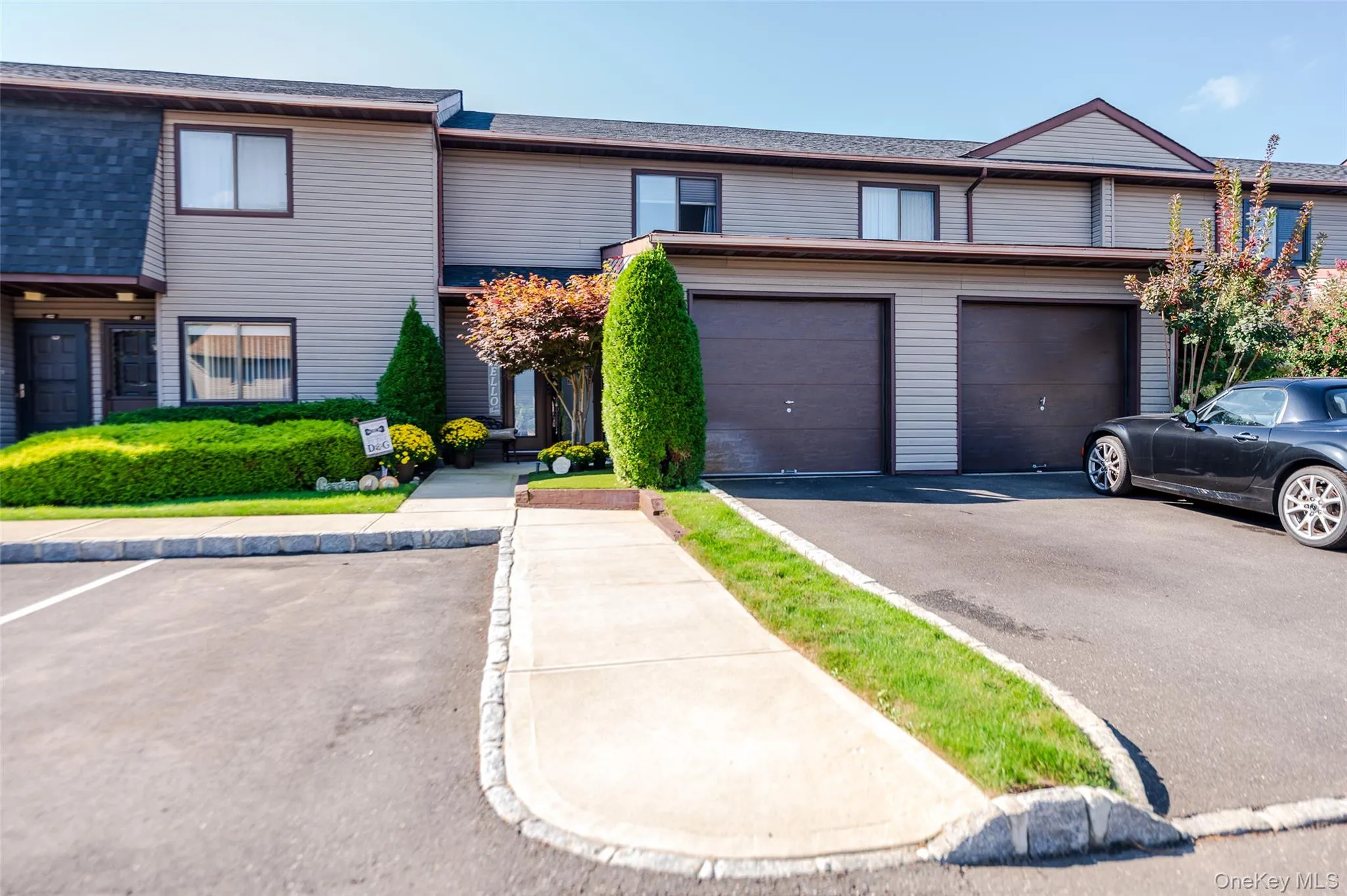 Traditional-style house featuring a shingled roof Traditional-style house featuring a shingled roof