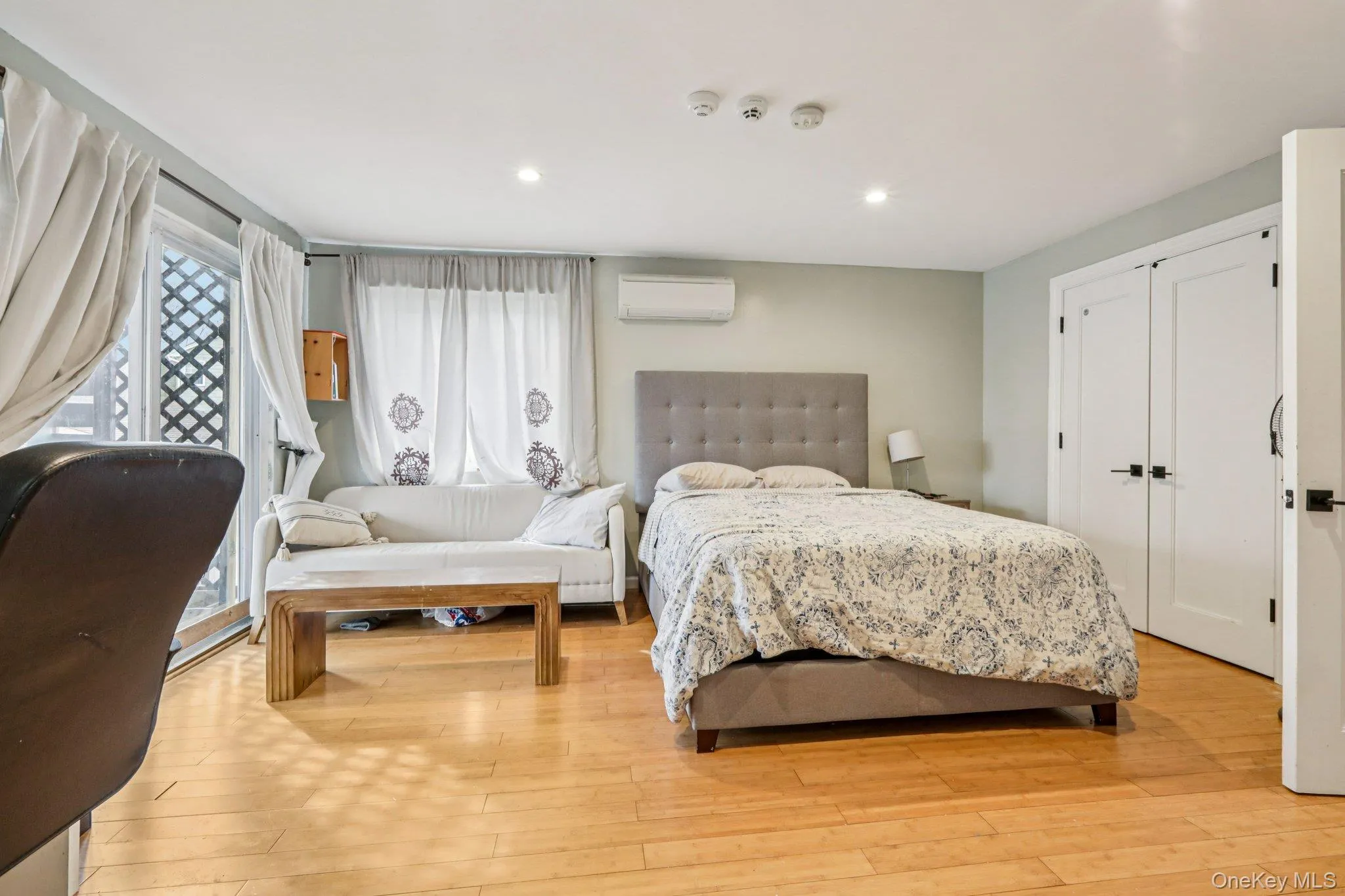 Primary Bedroom featuring light wood-style floors, a closet, and recessed lighting Primary Bedroom featuring light wood-style floors, a closet, and recessed lighting