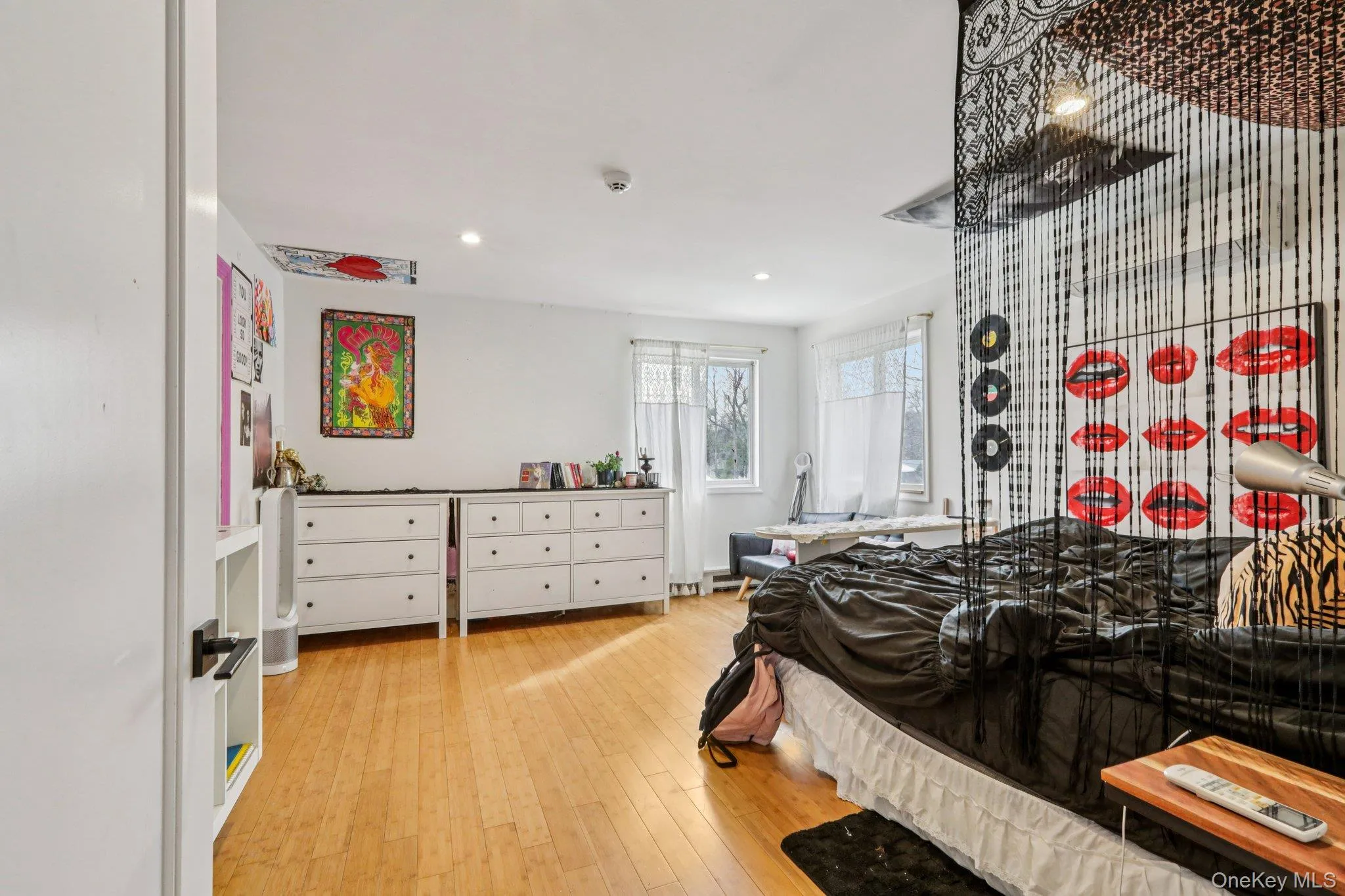 Bedroom featuring light wood-style floors and recessed lighting Bedroom featuring light wood-style floors and recessed lighting