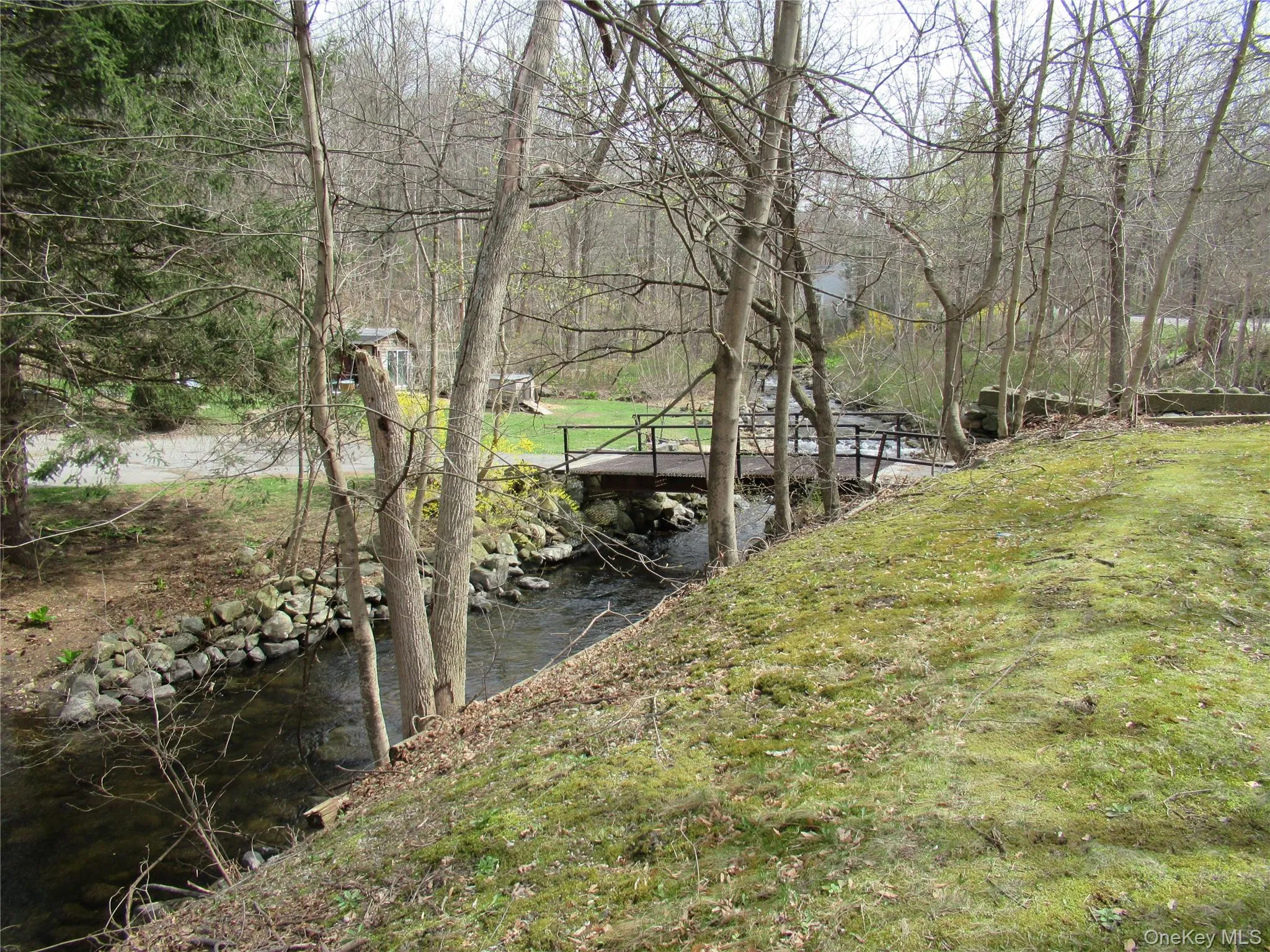 A babbling brook runs through the whole back of the property A babbling brook runs through the whole back of the property