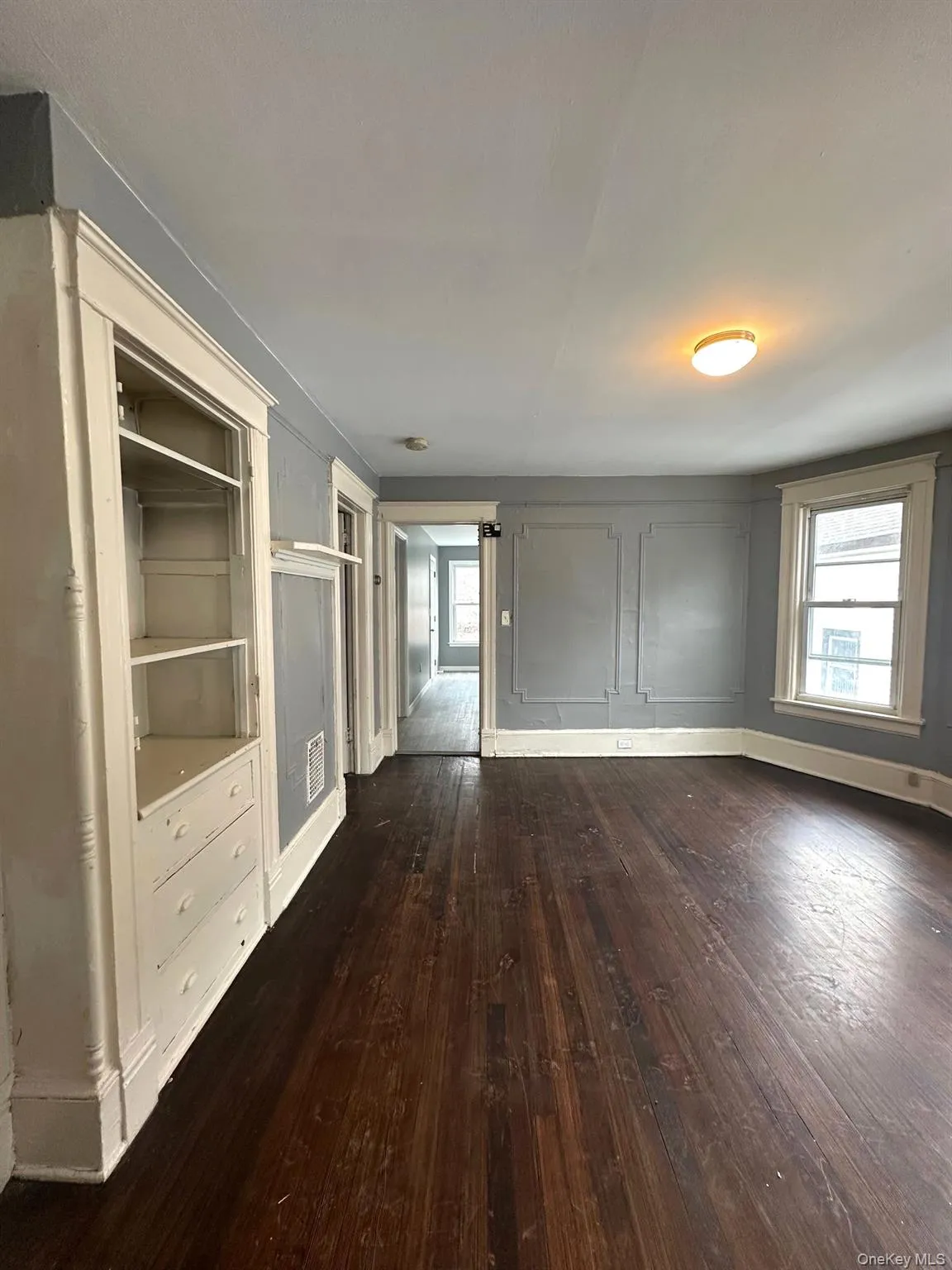 Large living room with built-ins and lots of light. Large living room with built-ins and lots of light.