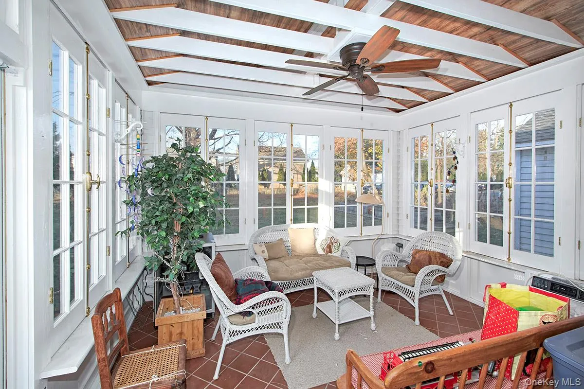 Three season room overlooks expansive yard Three season room overlooks expansive yard