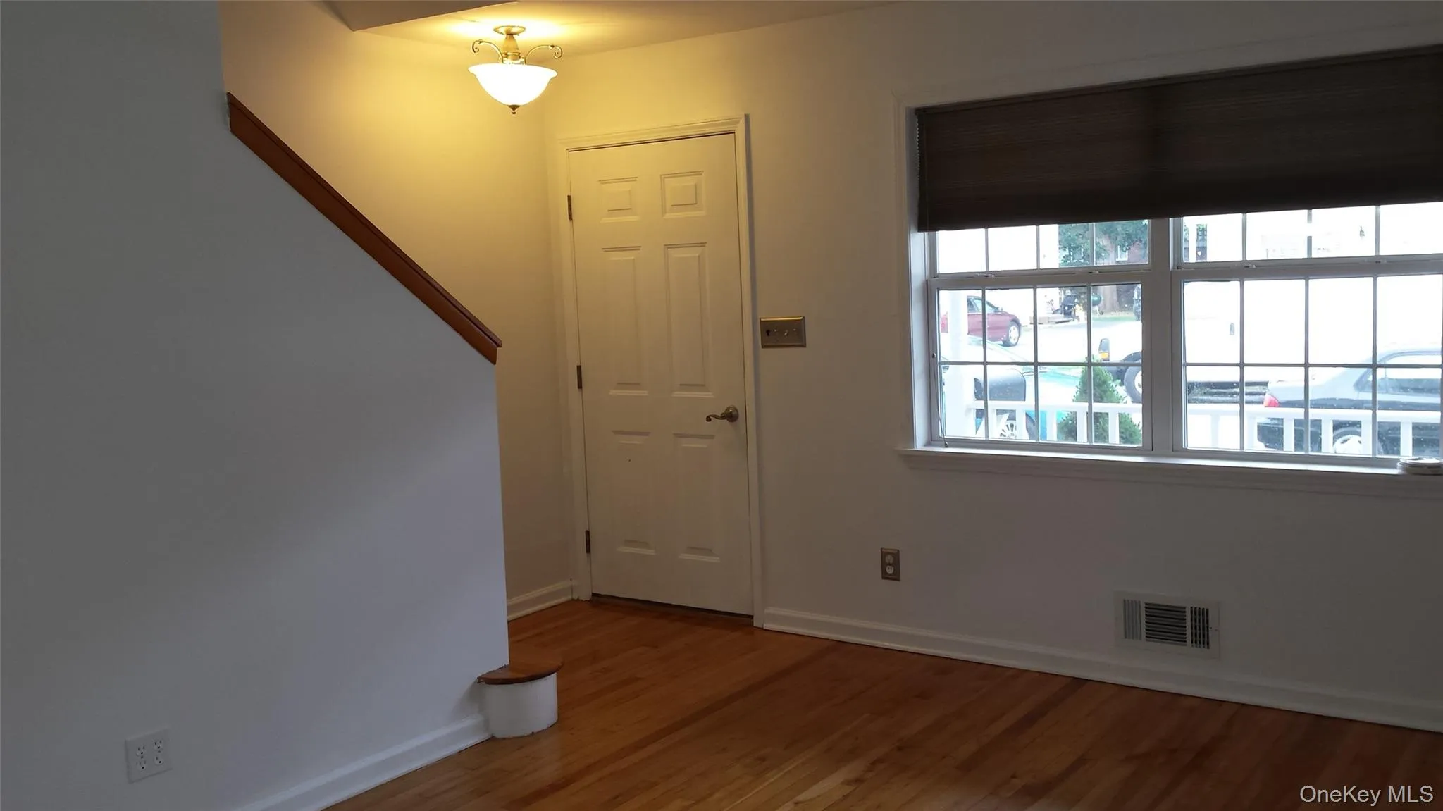 Foyer featuring wood-type flooring Foyer featuring wood-type flooring