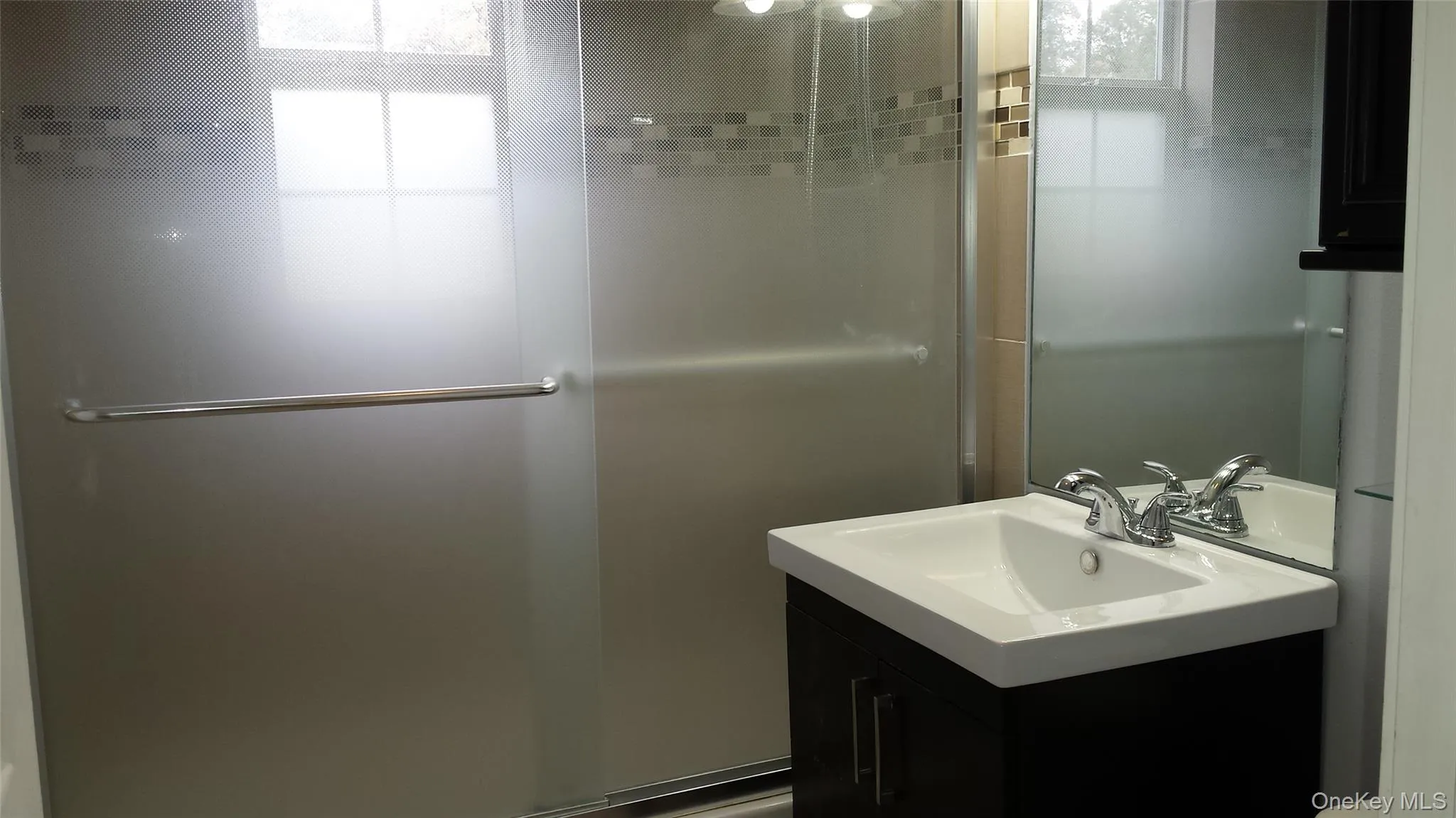 Bathroom featuring vanity Bathroom featuring vanity