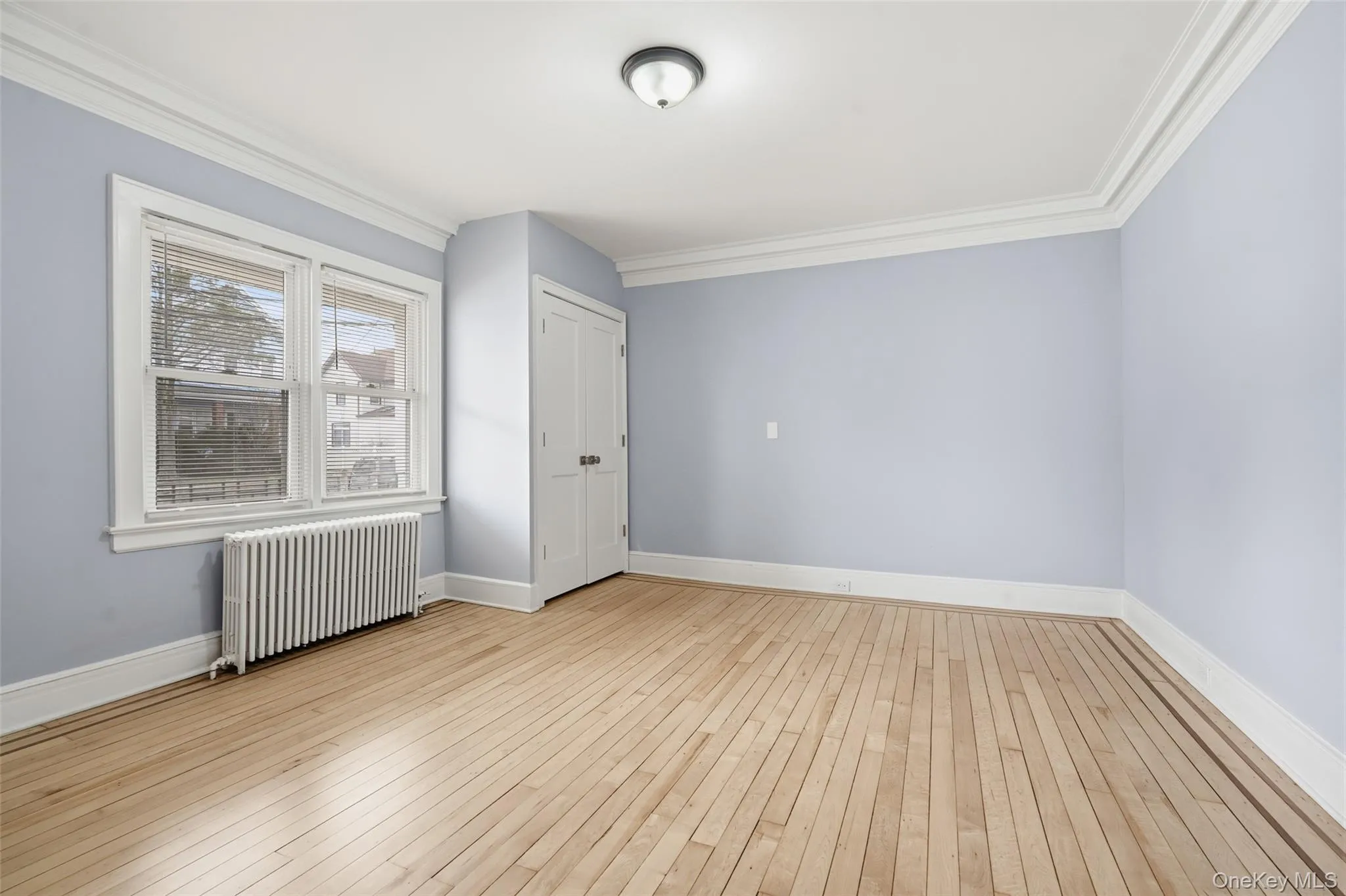 Spacious primary bedroom with natural light Spacious primary bedroom with natural light