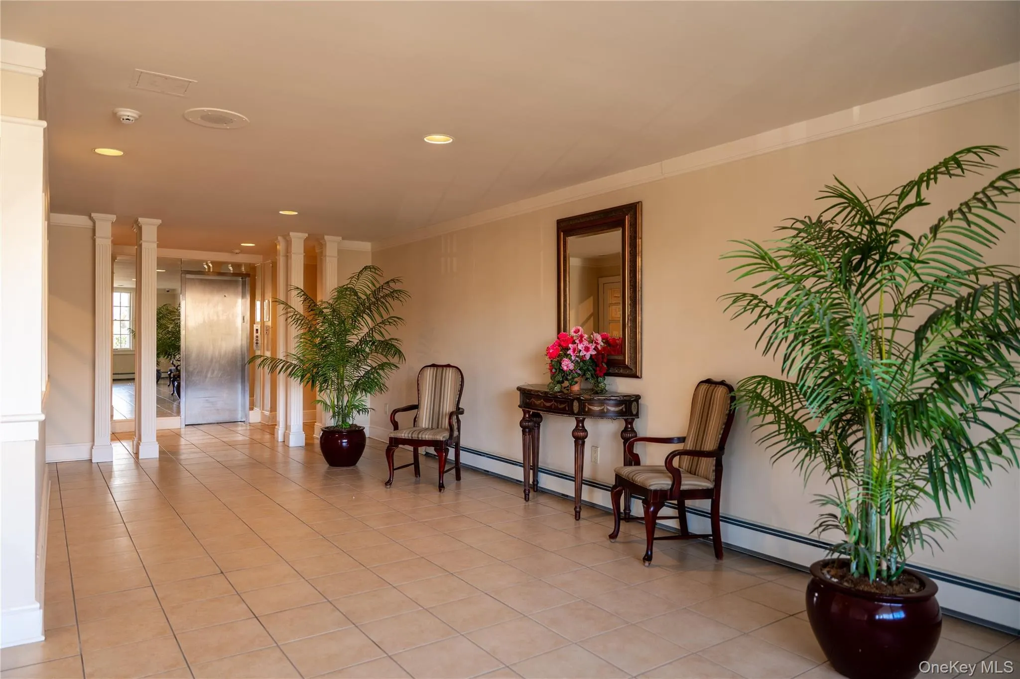 Building lobby. Laundry room and garage located right off lobby Building lobby. Laundry room and garage located right off lobby