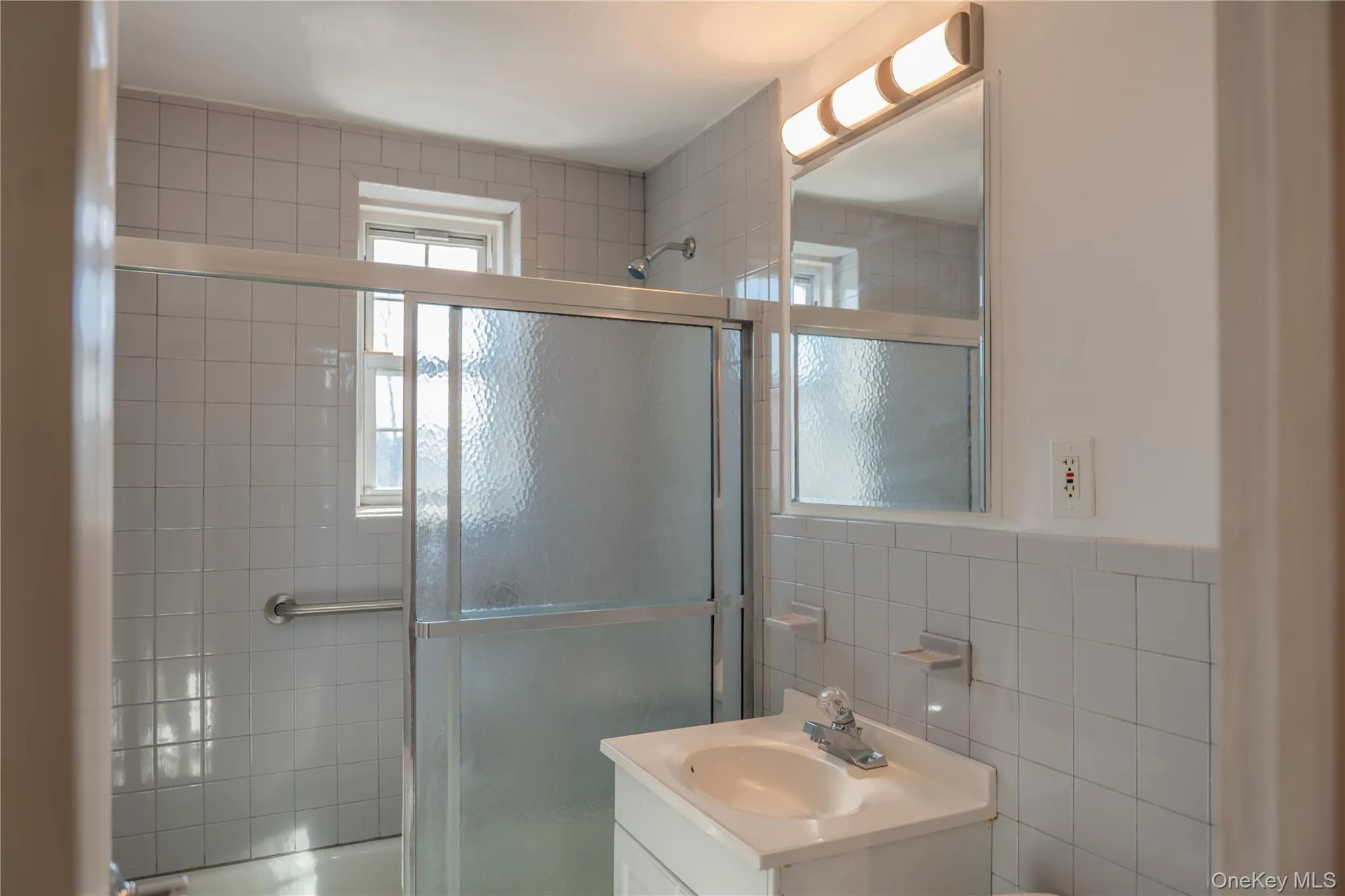 Neat and clean bathroom with new vanity Neat and clean bathroom with new vanity