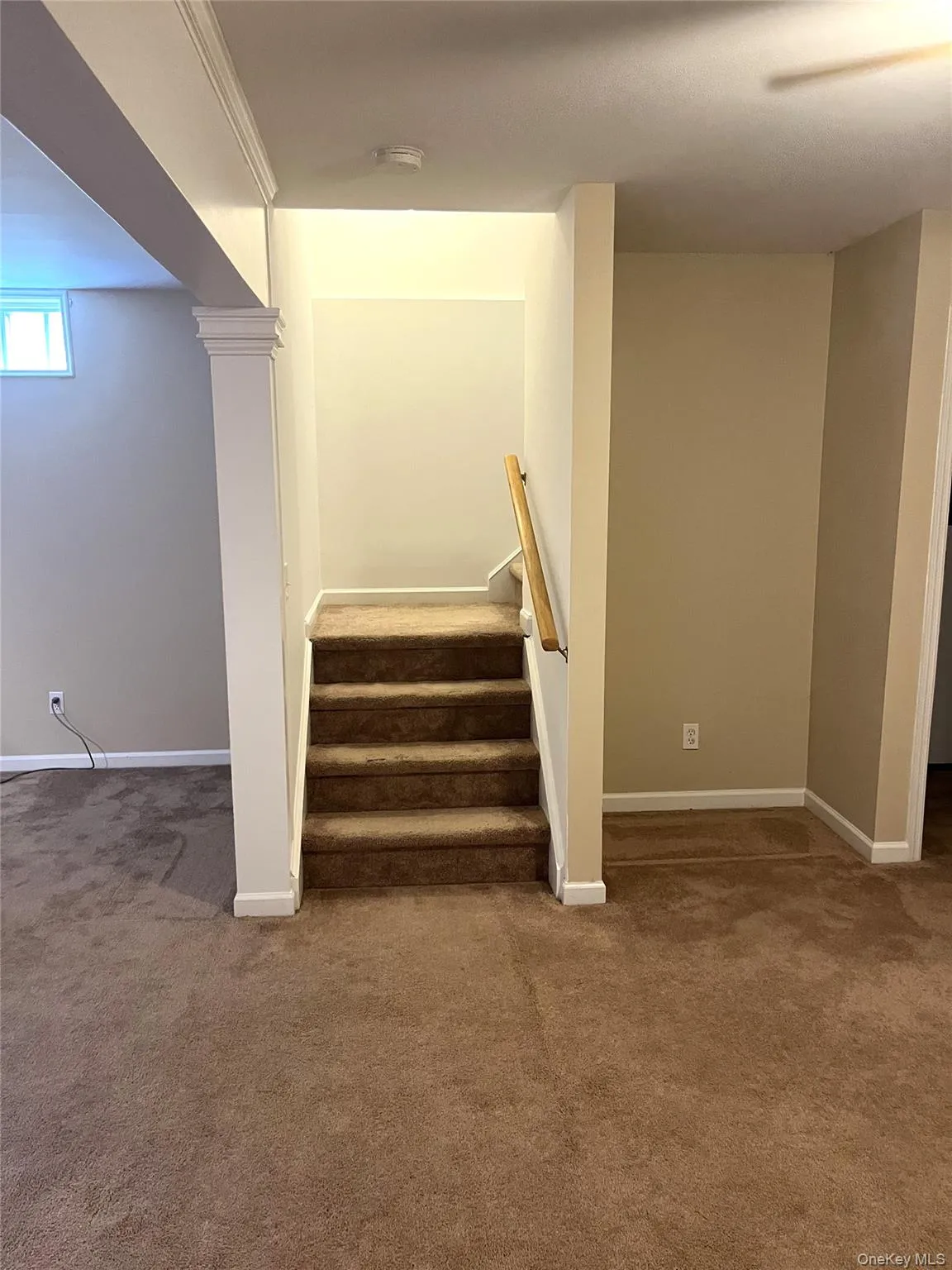Stairway with carpet flooring and baseboards Stairway with carpet flooring and baseboards