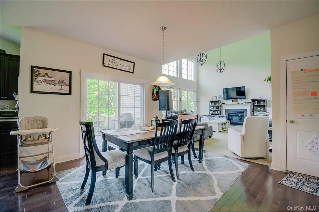 Dining space with dark hardwood / wood-style floors Dining space with dark hardwood / wood-style floors