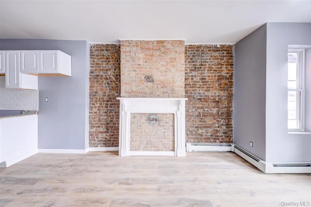 Fireplace and Original Mantle Place which is closed Off. Fireplace and Original Mantle Place which is closed Off.