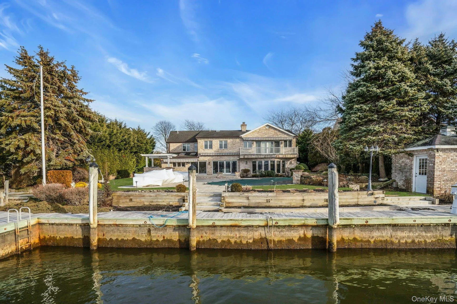 Great view of the back of the house from the water. Great view of the back of the house from the water.