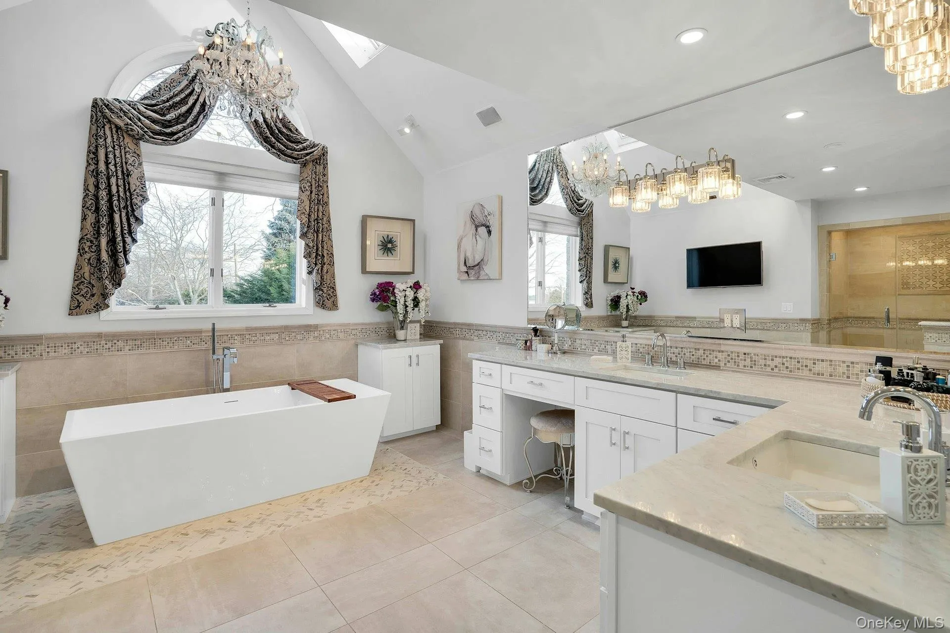 Brand new ensuite bath has cathedral ceilings and double vanities. Brand new ensuite bath has cathedral ceilings and double vanities.