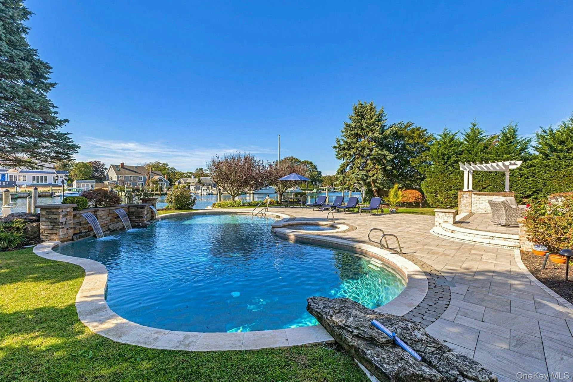 Gunite, heated, salt-water with jacuzzi and new waterfalls. Gunite, heated, salt-water with jacuzzi and new waterfalls.