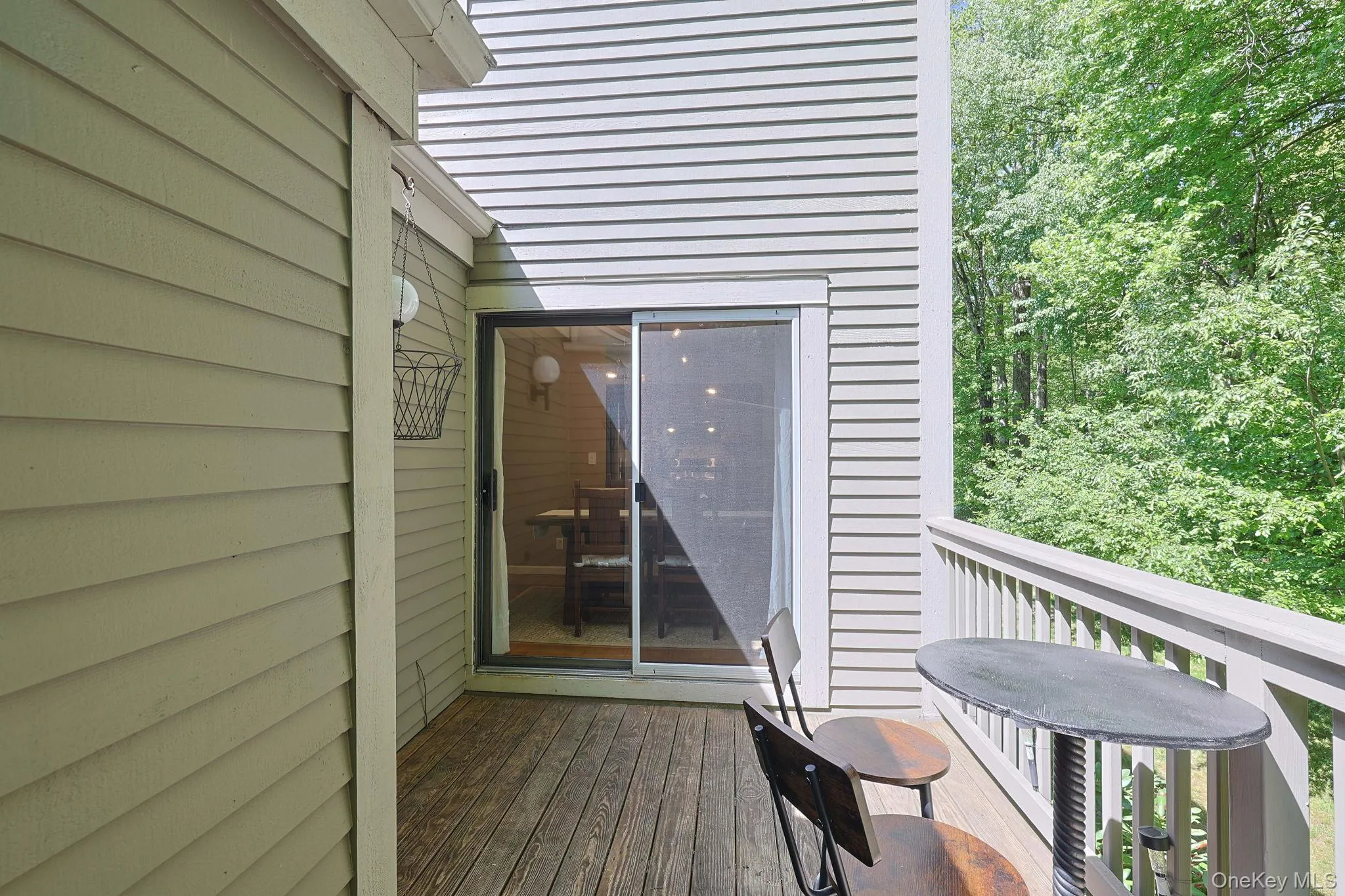 Sliding door leading to the back deck Sliding door leading to the back deck