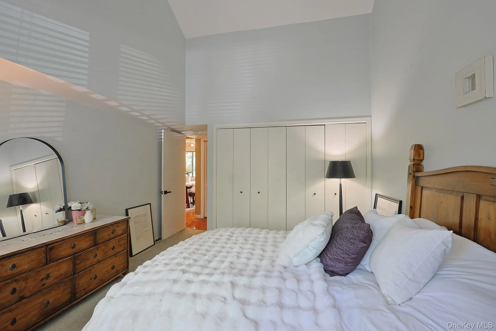 Primary bedroom featuring plenty of closet space Primary bedroom featuring plenty of closet space