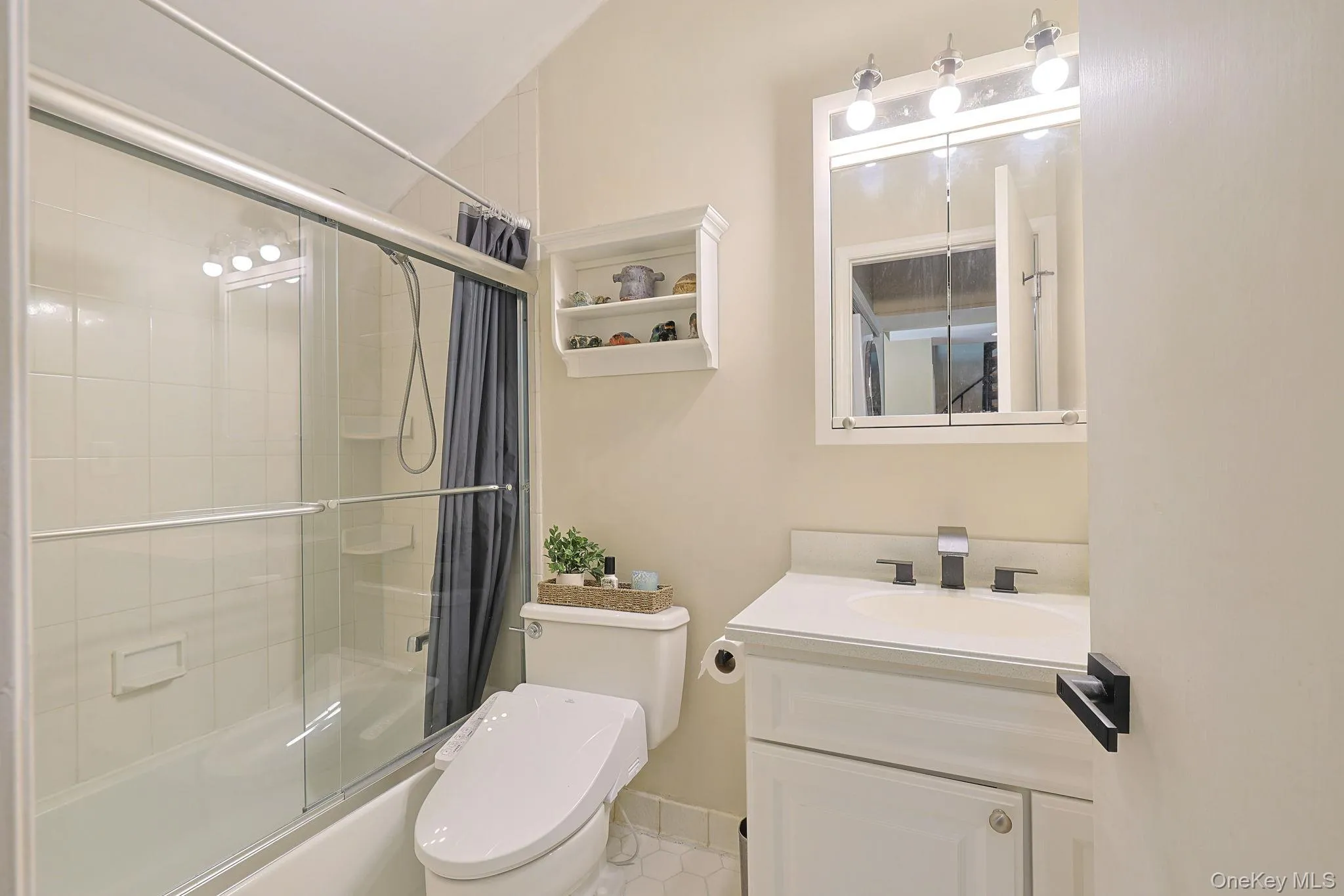 Full bathroom featuring shower and sink faucet with LED blue light waterfall Full bathroom featuring shower and sink faucet with LED blue light waterfall