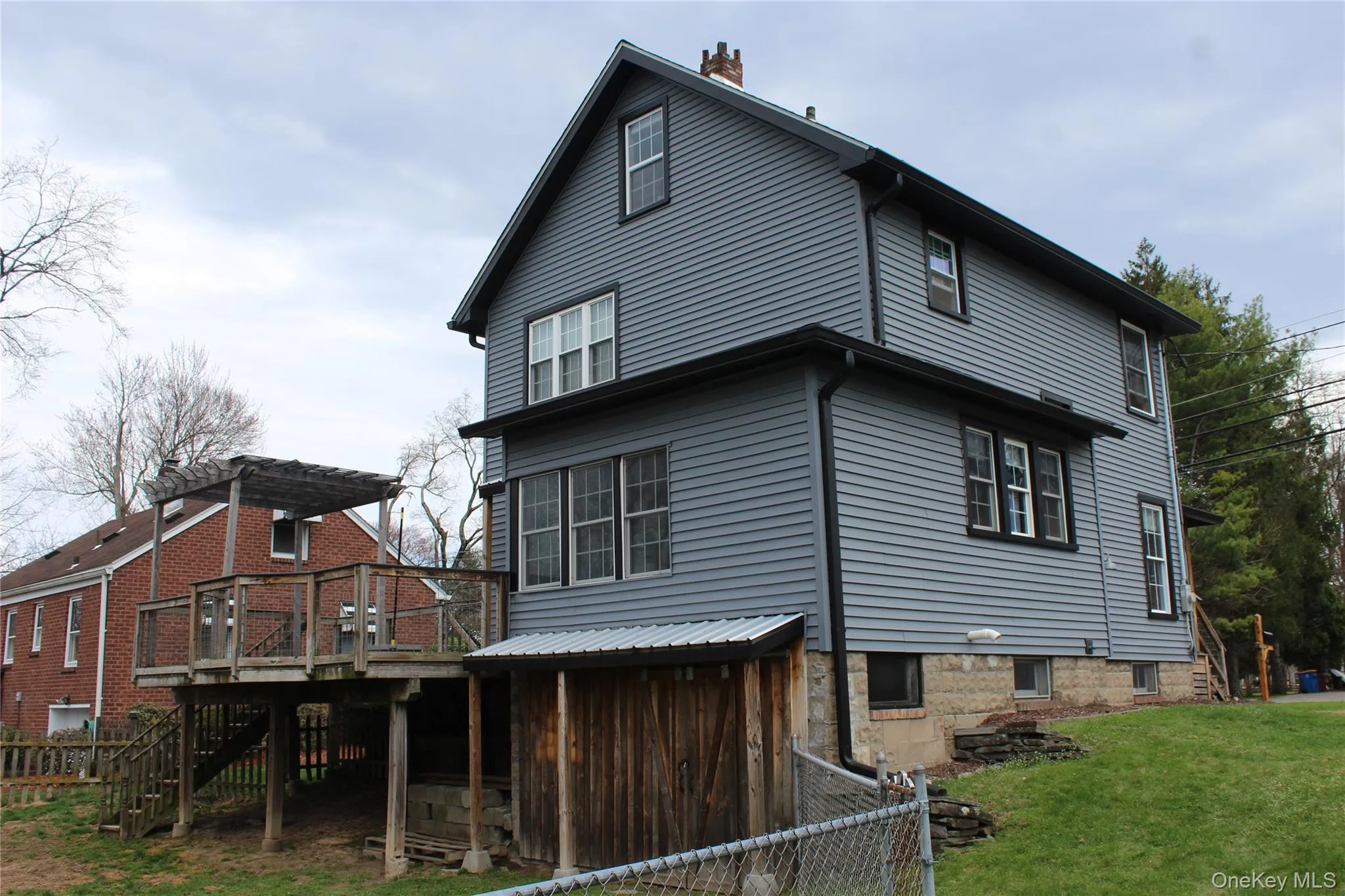 Rear of House showing Rear Deck, and Shed. Rear of House showing Rear Deck, and Shed.