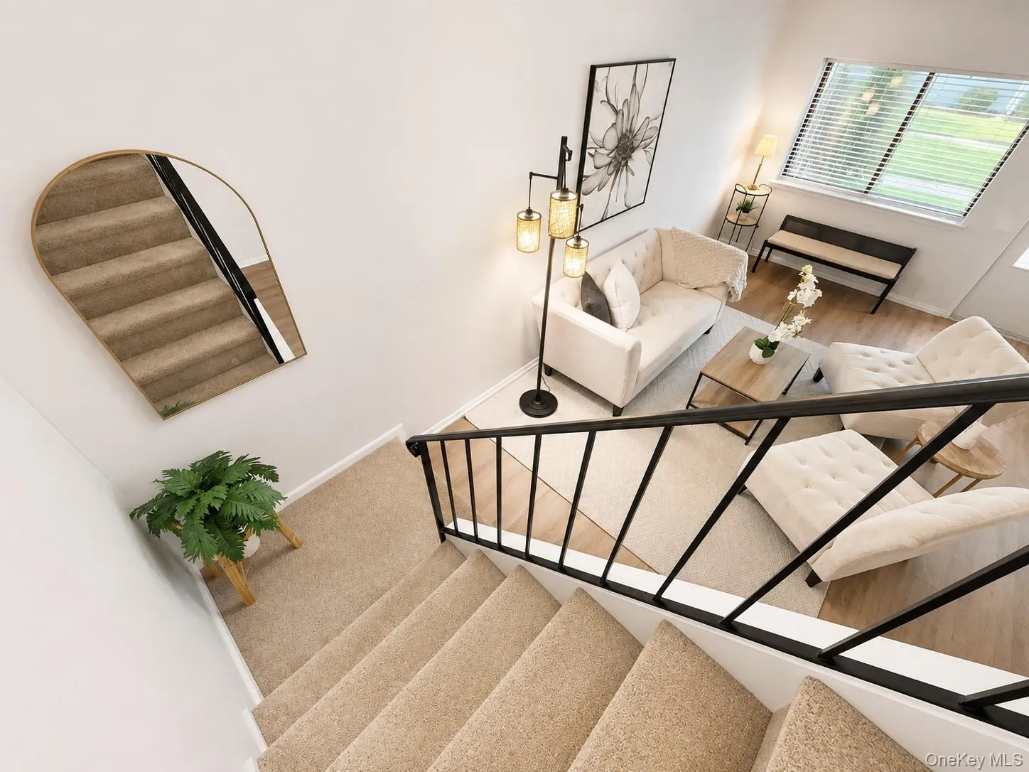 Step down into a bright and inviting living room featuring soaring ceilings, abundant natural light, and an open, airy feel. The spacious layout offers a comfortable setting for everyday living and entertaining, enhanced by neutral finishes, updated flooring, and a seamless flow to the dining area. The dramatic overlook from the staircase adds architectural interest and creates a welcoming first impression. Step down into a bright and inviting living room featuring soaring ceilings, abundant natural light, and an open, airy feel. The spacious layout offers a comfortable setting for everyday living and entertaining, enhanced by neutral finishes, updated flooring, and a seamless flow to the dining area. The dramatic overlook from the staircase adds architectural interest and creates a welcoming first impression.