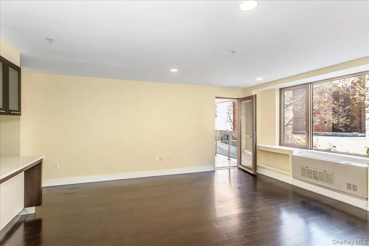 Unfurnished room with recessed lighting and dark wood-style flooring Unfurnished room with recessed lighting and dark wood-style flooring