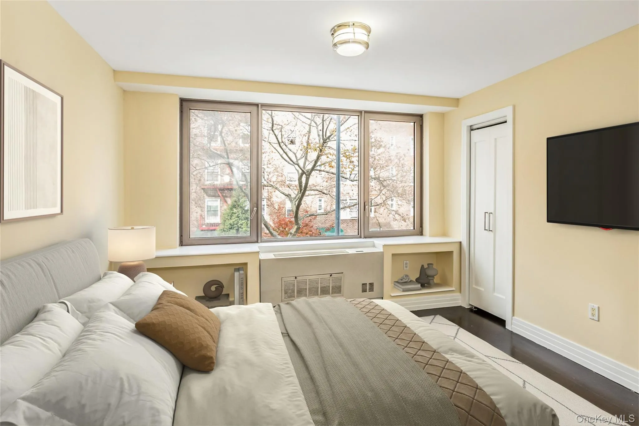 Bedroom featuring baseboards and dark wood-type flooring Bedroom featuring baseboards and dark wood-type flooring