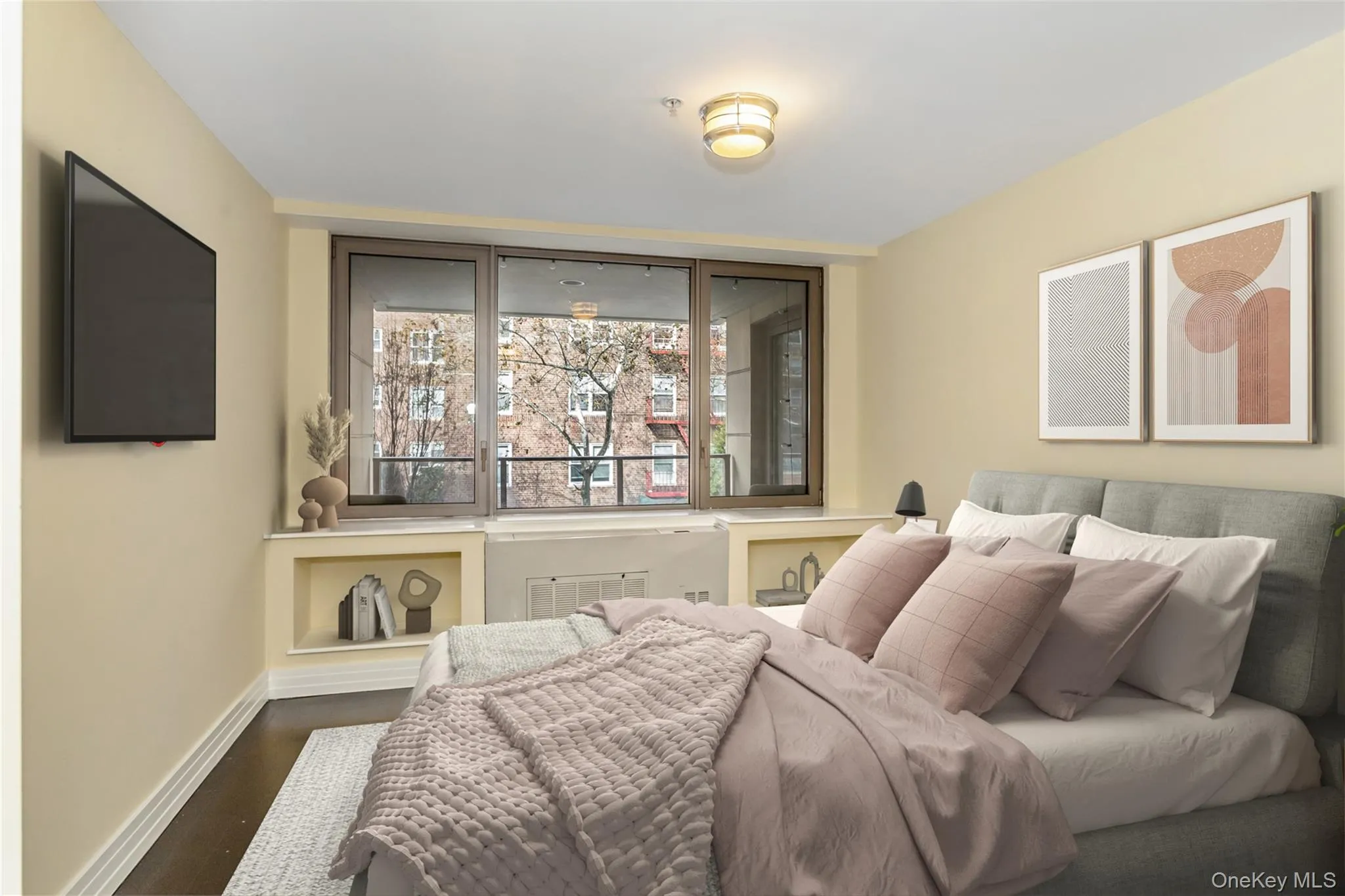 Bedroom featuring baseboards and wood finished floors Bedroom featuring baseboards and wood finished floors