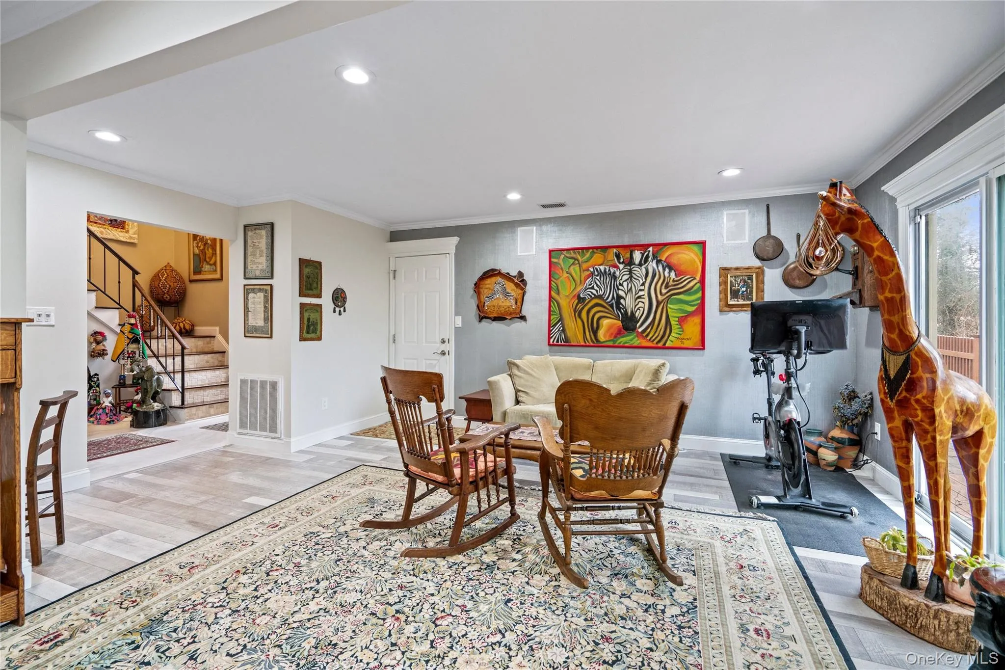 Open Den with wood-style flooring from kitchen Open Den with wood-style flooring from kitchen
