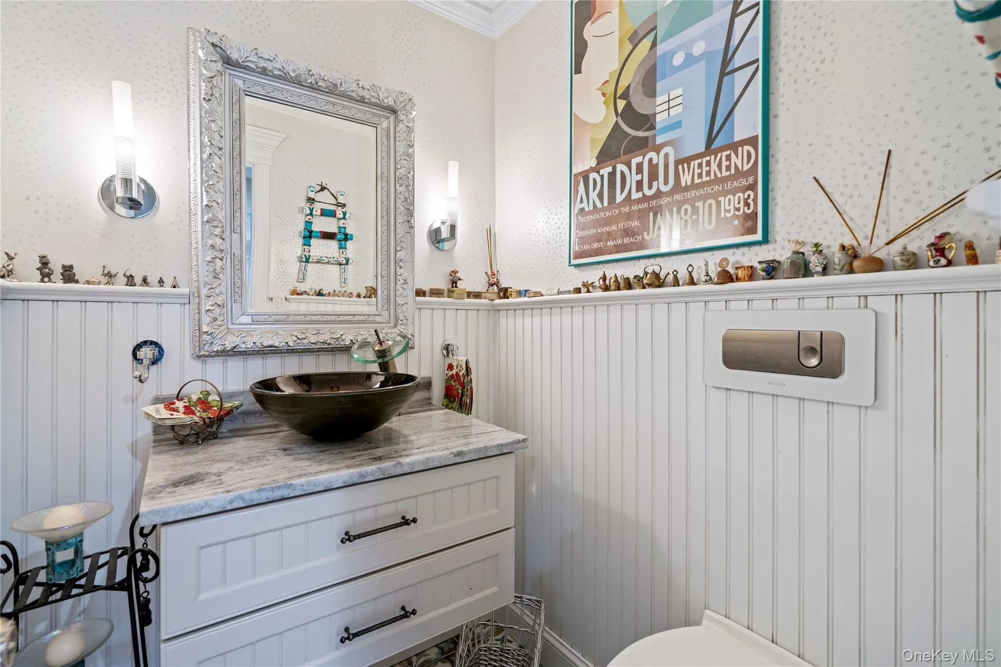 Bathroom featuring vanity, a wainscoted wall, and crown molding Bathroom featuring vanity, a wainscoted wall, and crown molding