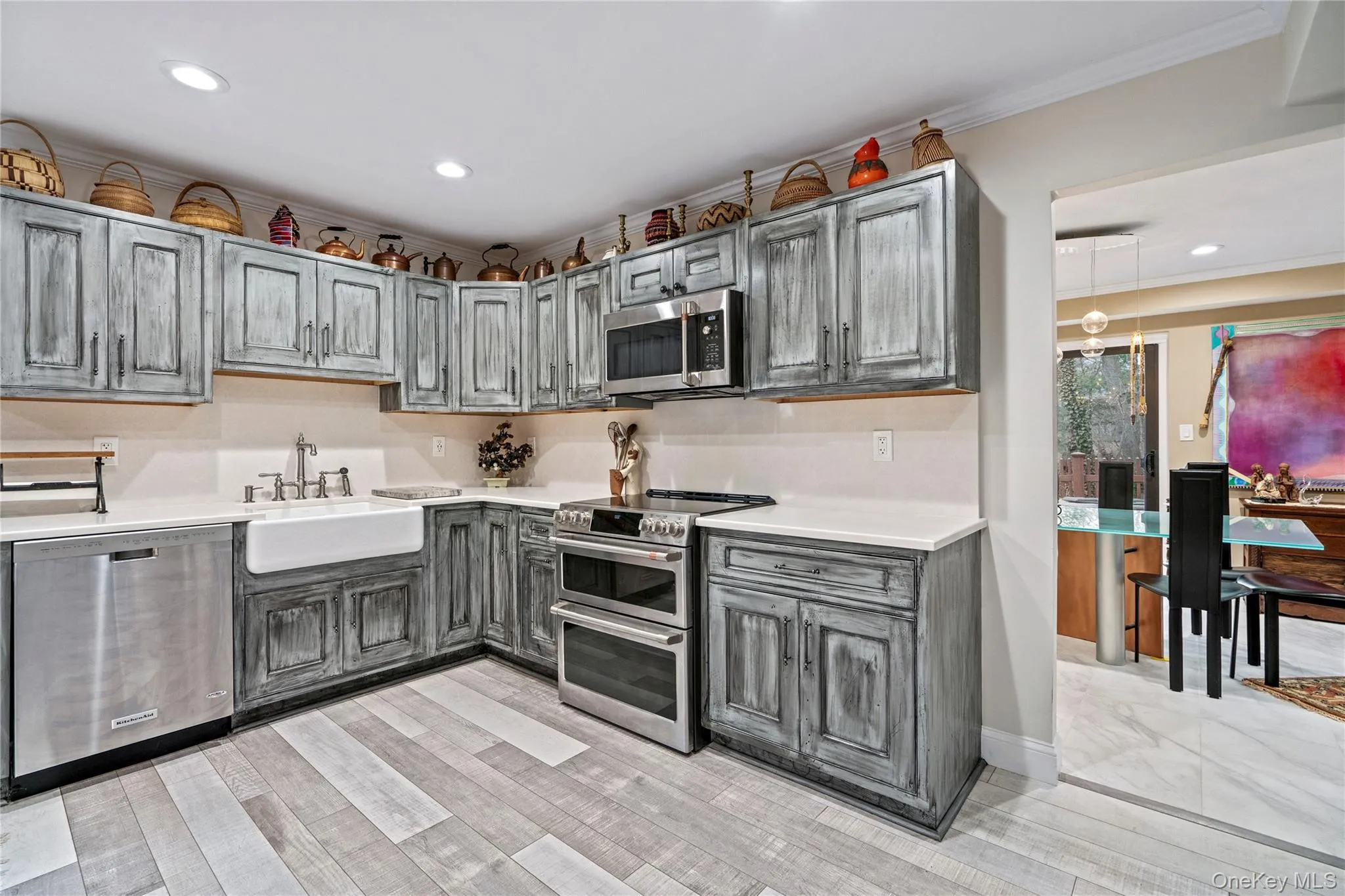 Kitchen featuring stainless steel appliances, recessed lighting, and crown molding Kitchen featuring stainless steel appliances, recessed lighting, and crown molding