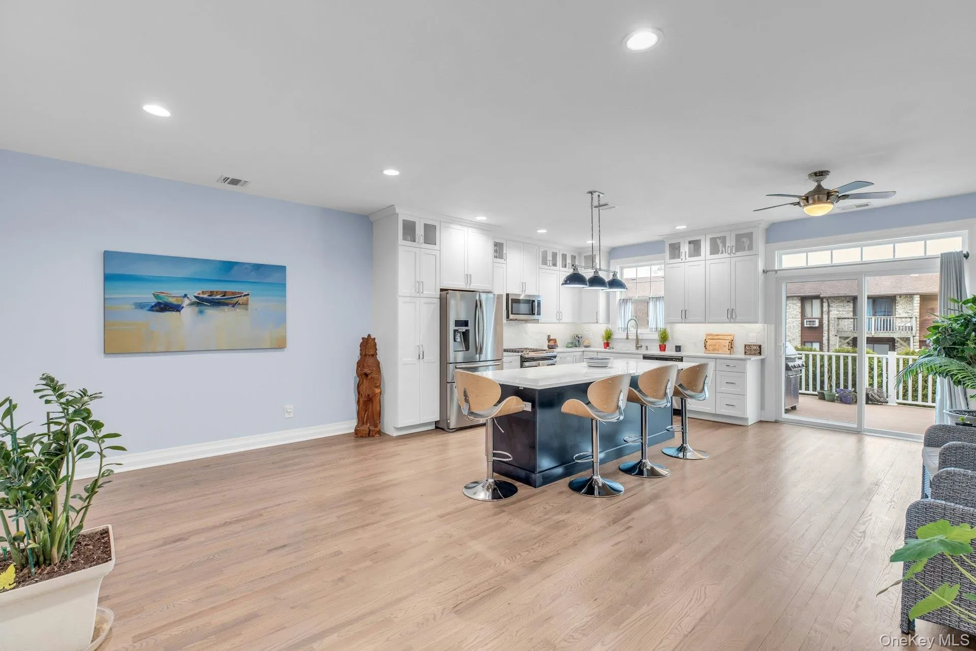 Main Level with New Kitchen, Living Room and Dining Areas, and sliding doors to rear deck. Main Level with New Kitchen, Living Room and Dining Areas, and sliding doors to rear deck.