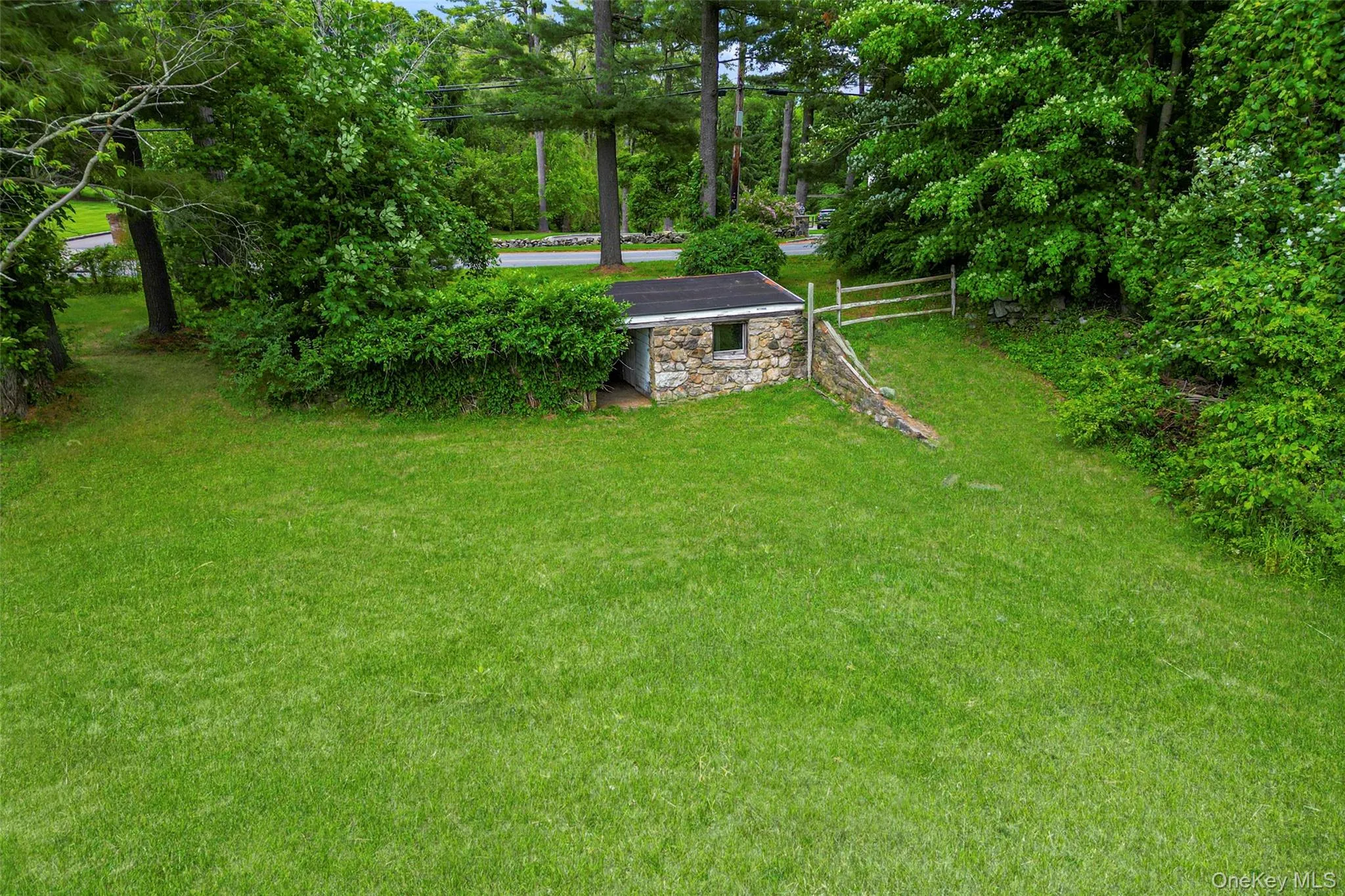 View of yard with a stone barn View of yard with a stone barn
