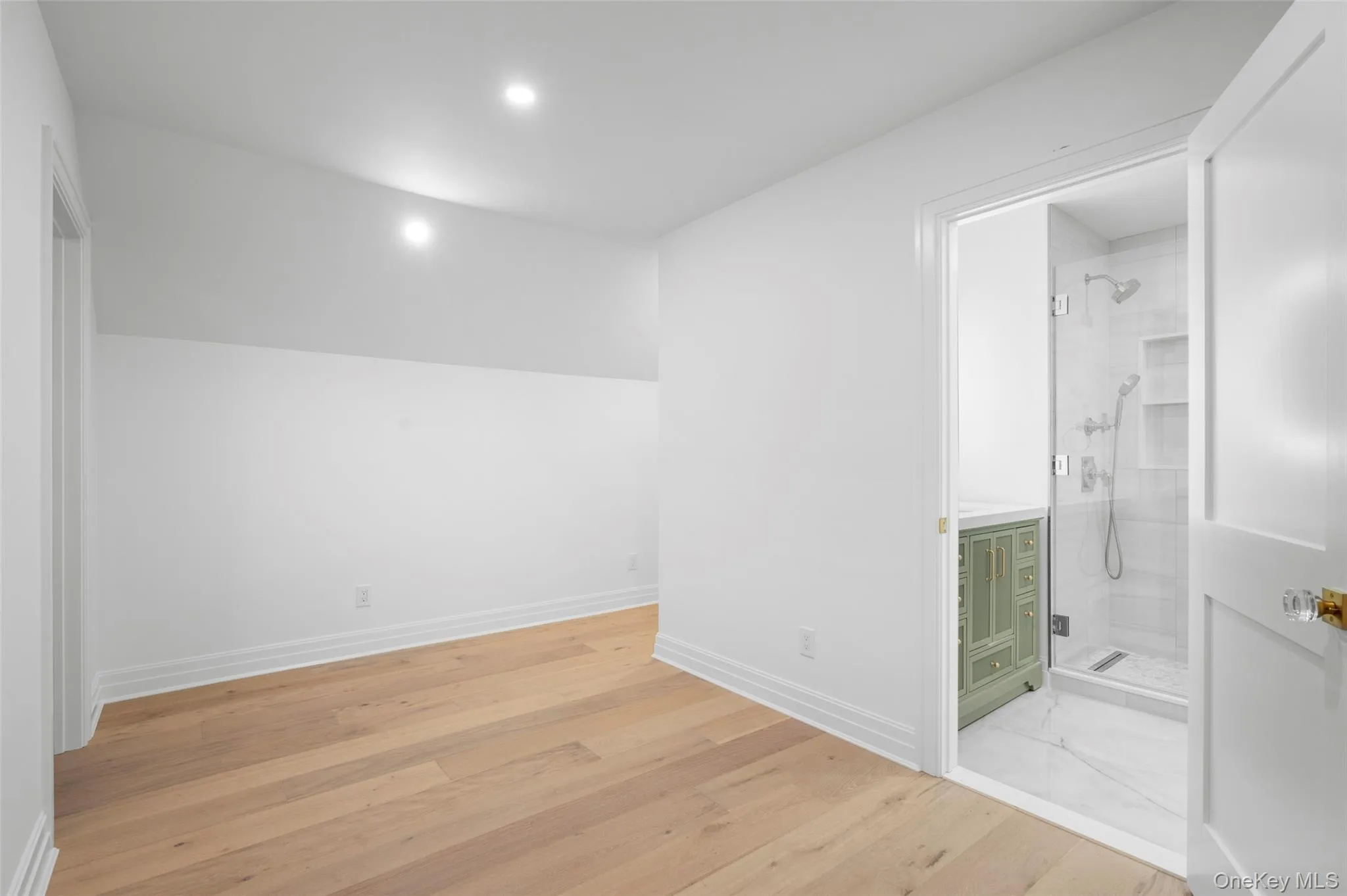 Guest room bonus room or possible office space featuring light wood-style flooring and recessed lighting Guest room bonus room or possible office space featuring light wood-style flooring and recessed lighting