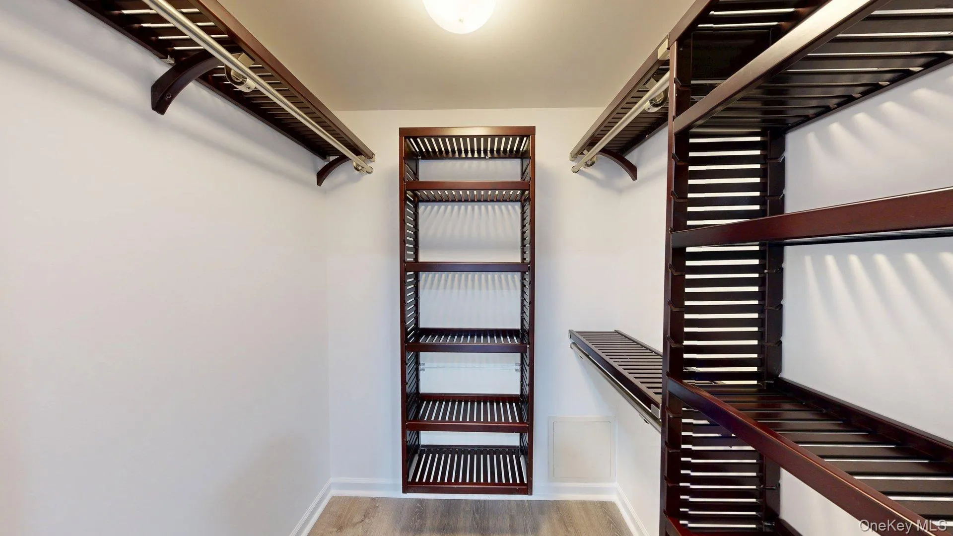 Bedroom closet w/wood shelving organization Bedroom closet w/wood shelving organization