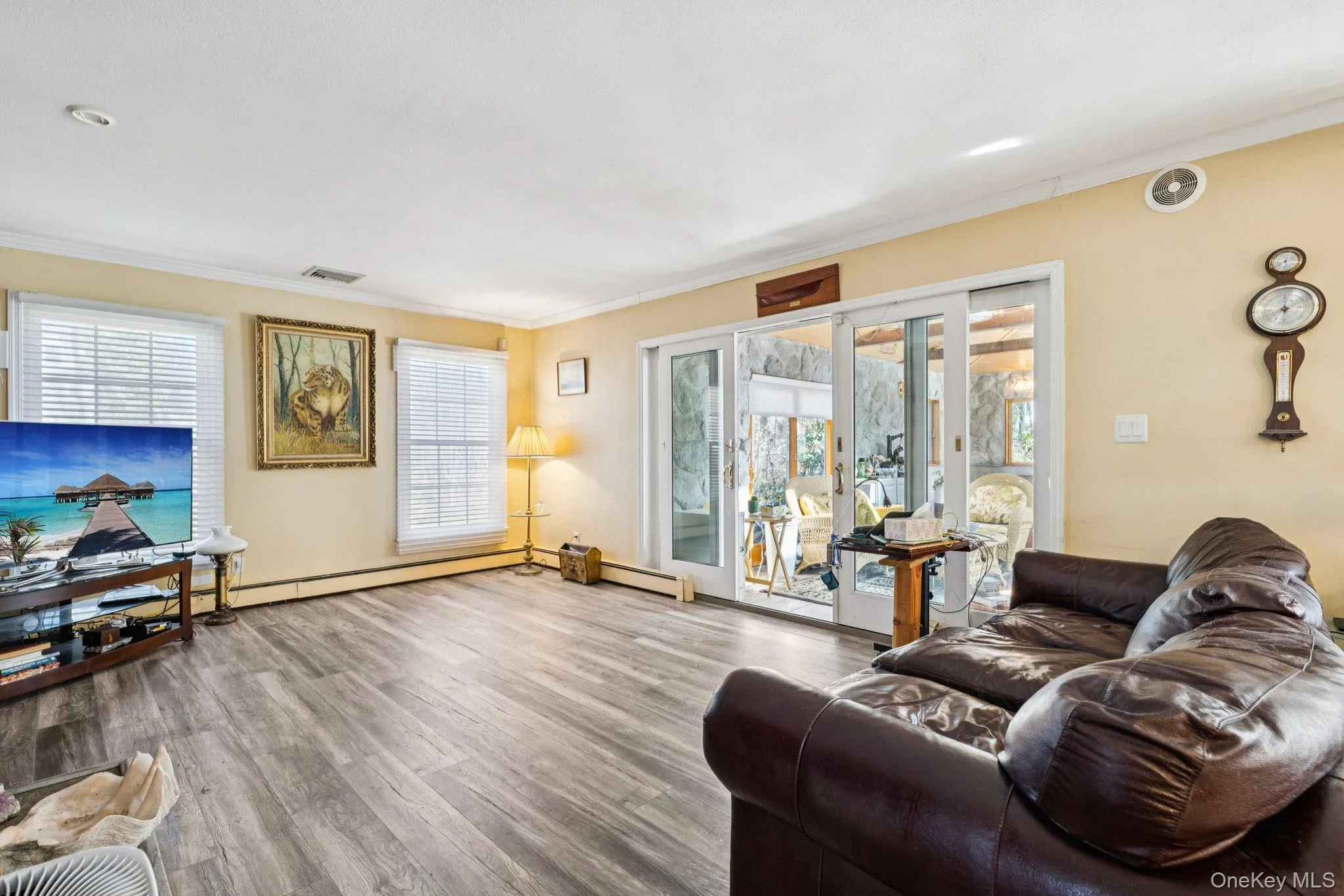 Large Den with Sliders to Sun Room Large Den with Sliders to Sun Room
