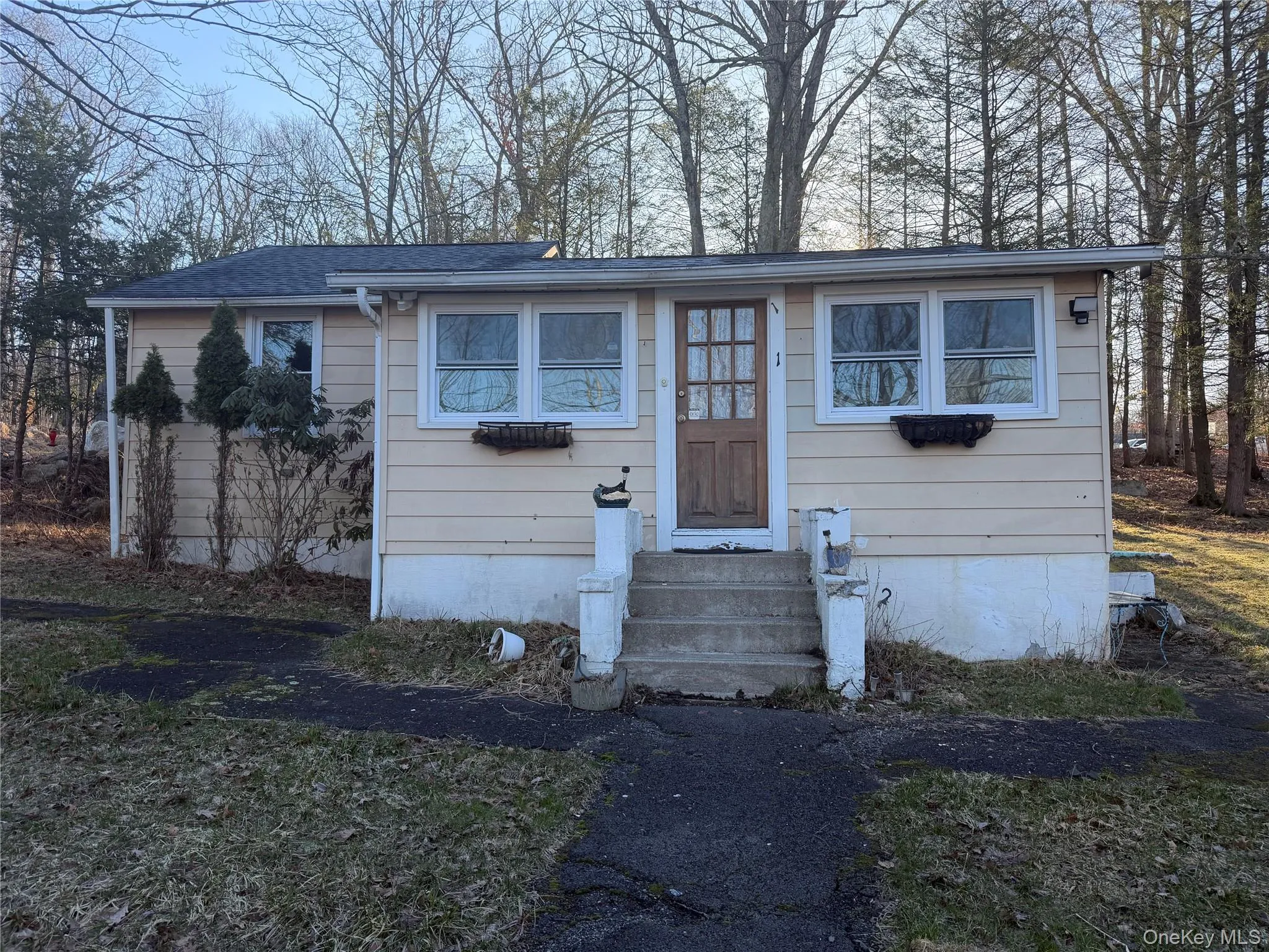 View of front of home featuring entry steps and a shingled roof View of front of home featuring entry steps and a shingled roof