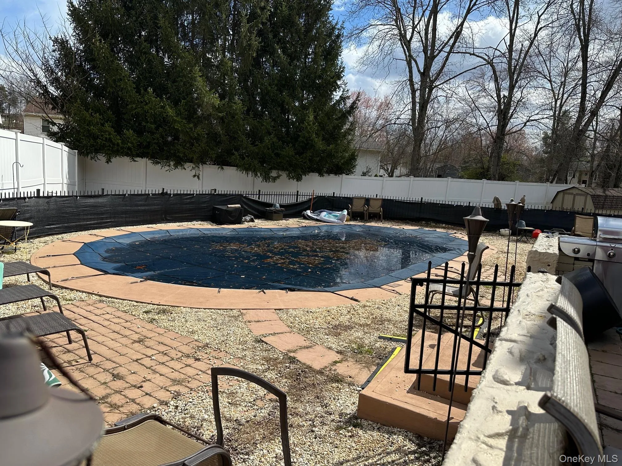 View of swimming pool with a fenced backyard and patio surround View of swimming pool with a fenced backyard and patio surround