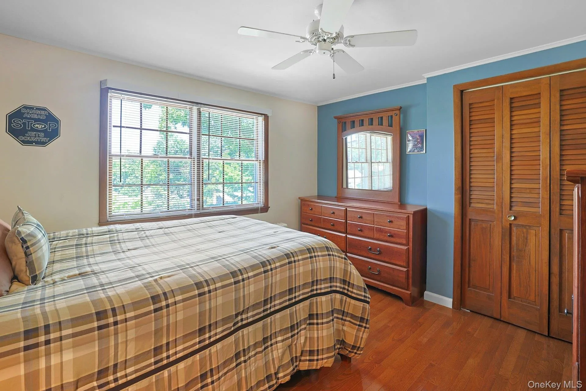 Bedroom featuring hardwood floors, a closet, and ceiling fan. This room is now empty. Bedroom featuring hardwood floors, a closet, and ceiling fan. This room is now empty.