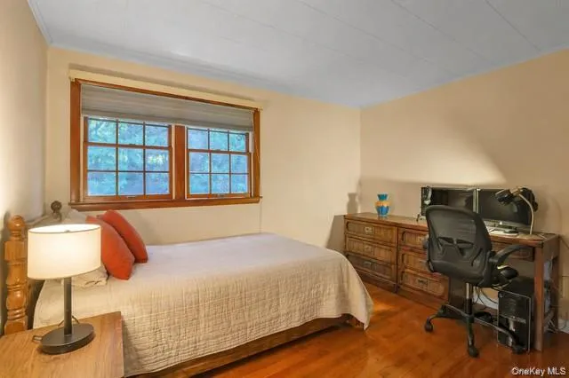 Bedroom with hardwood flooring Bedroom with hardwood flooring