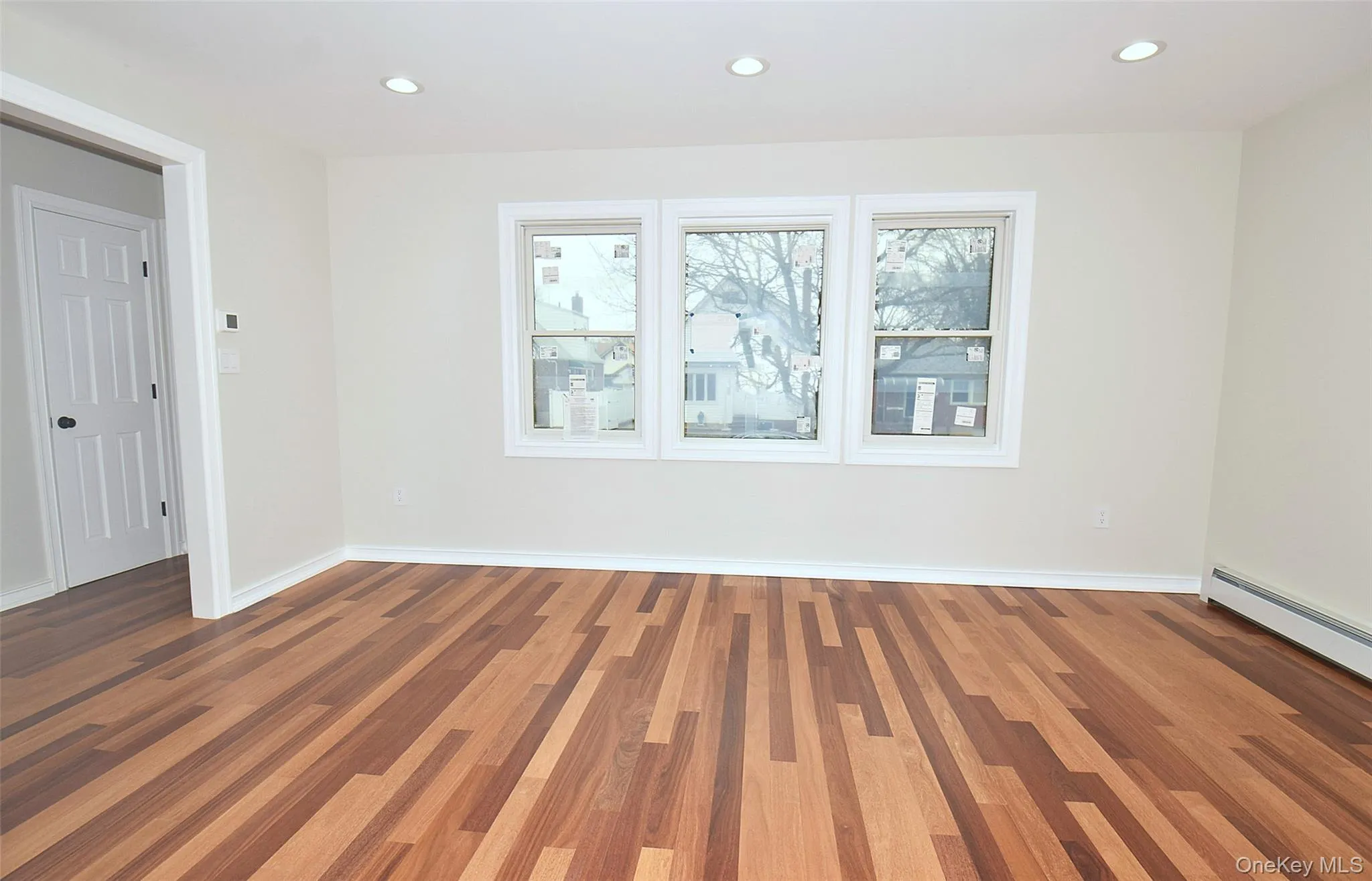 Living room with stunning hardwood flooring Living room with stunning hardwood flooring