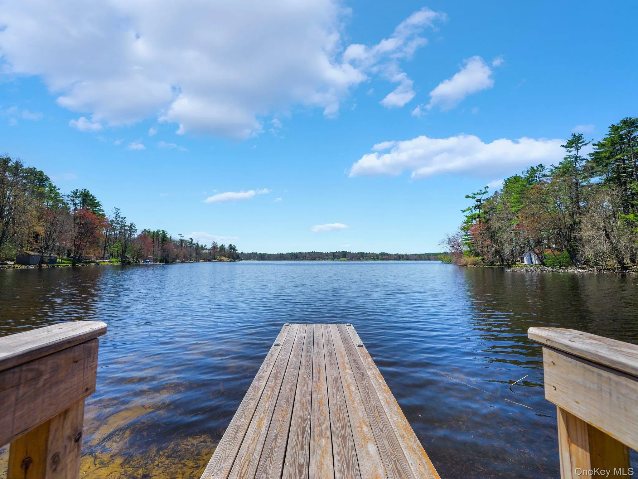 View of dock featuring a water view View of dock featuring a water view