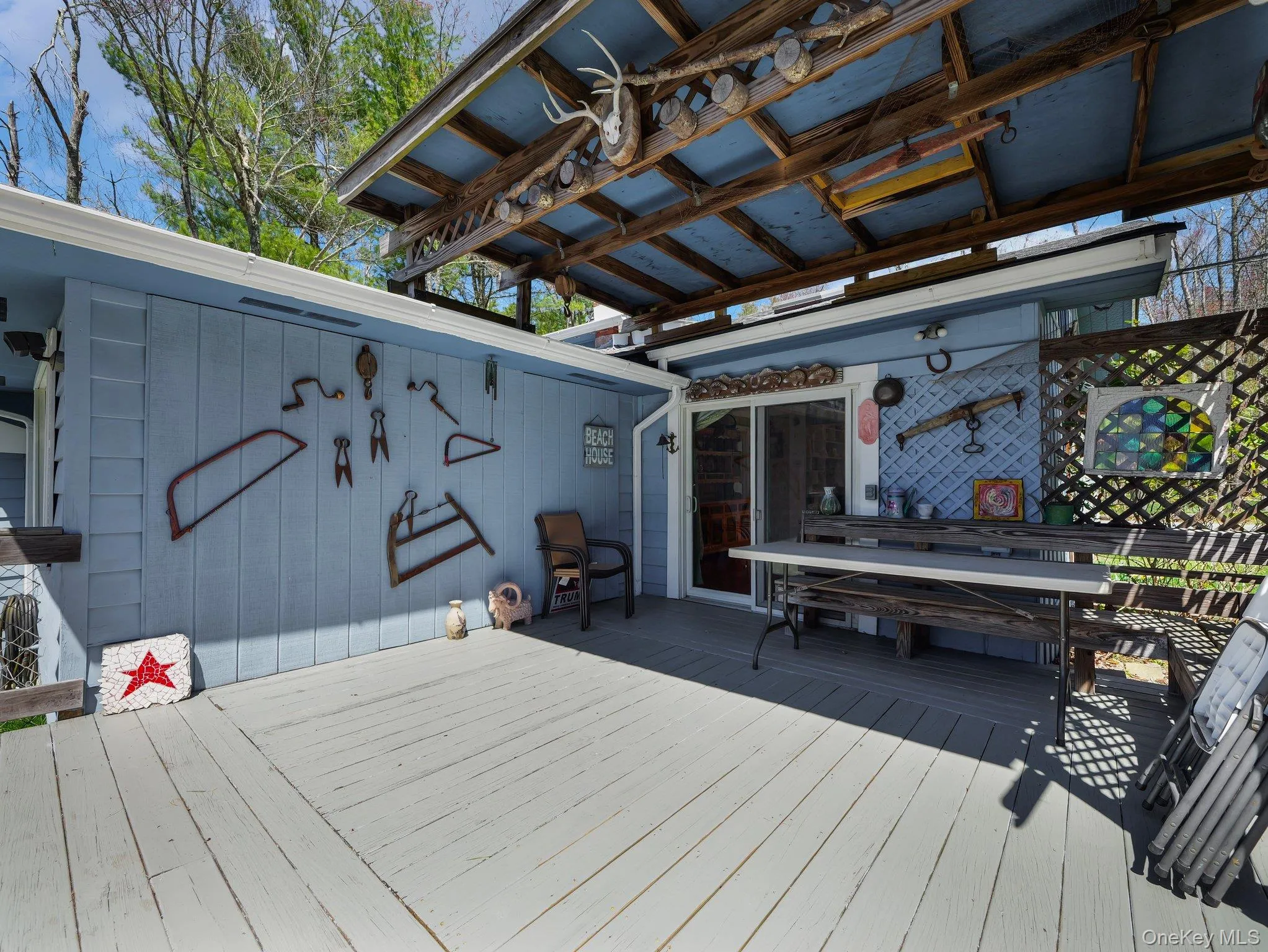 Wooden covered deck with Pergola and outdoor dining space Wooden covered deck with Pergola and outdoor dining space