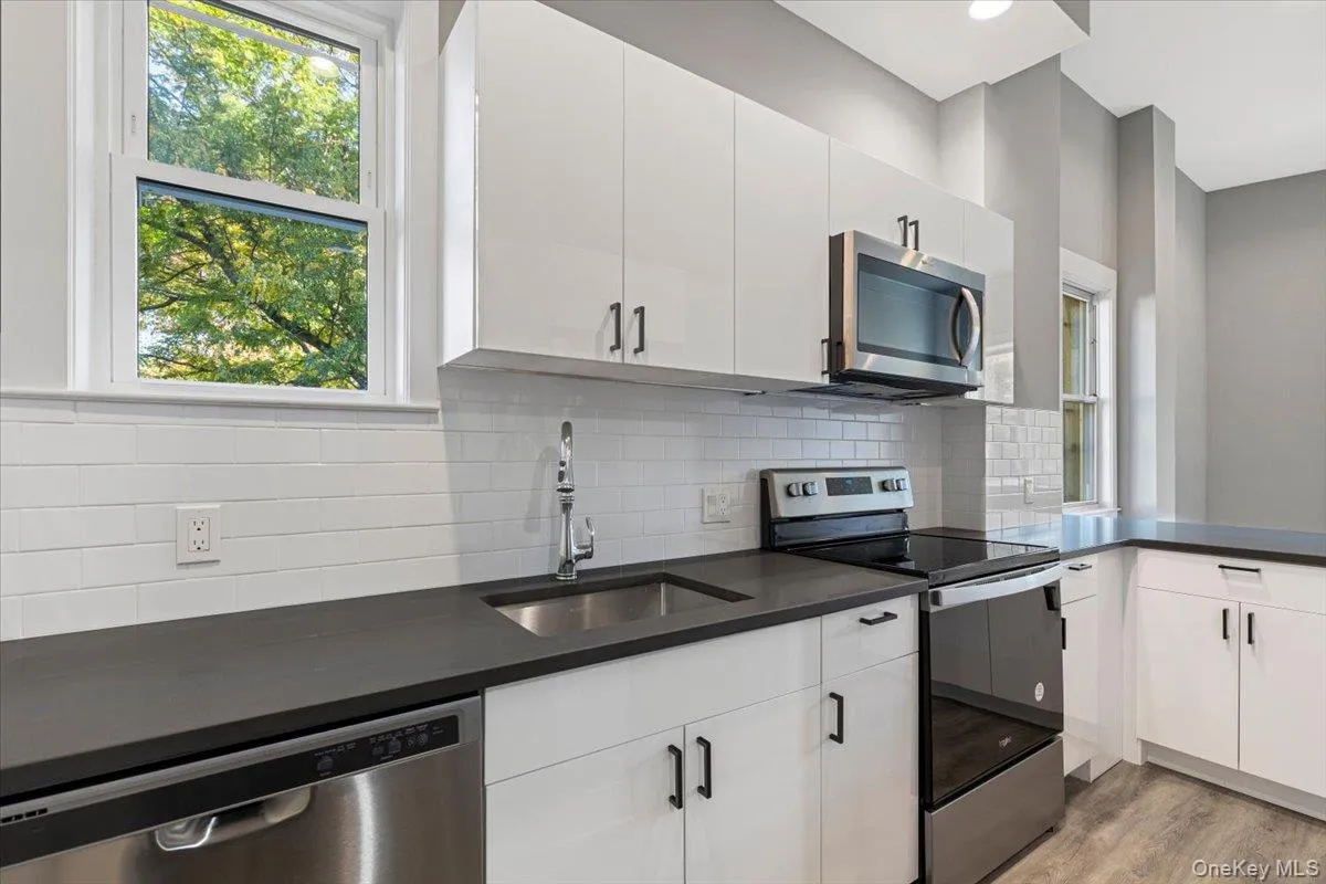 Modern kitchen with quartz countertops and stainless steel appliances. Modern kitchen with quartz countertops and stainless steel appliances.