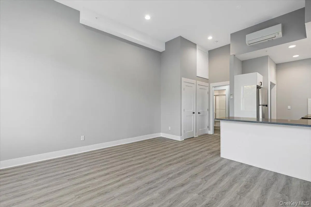 Bright, open-concept living space with high ceilings and a loft-like feel. Bright, open-concept living space with high ceilings and a loft-like feel.