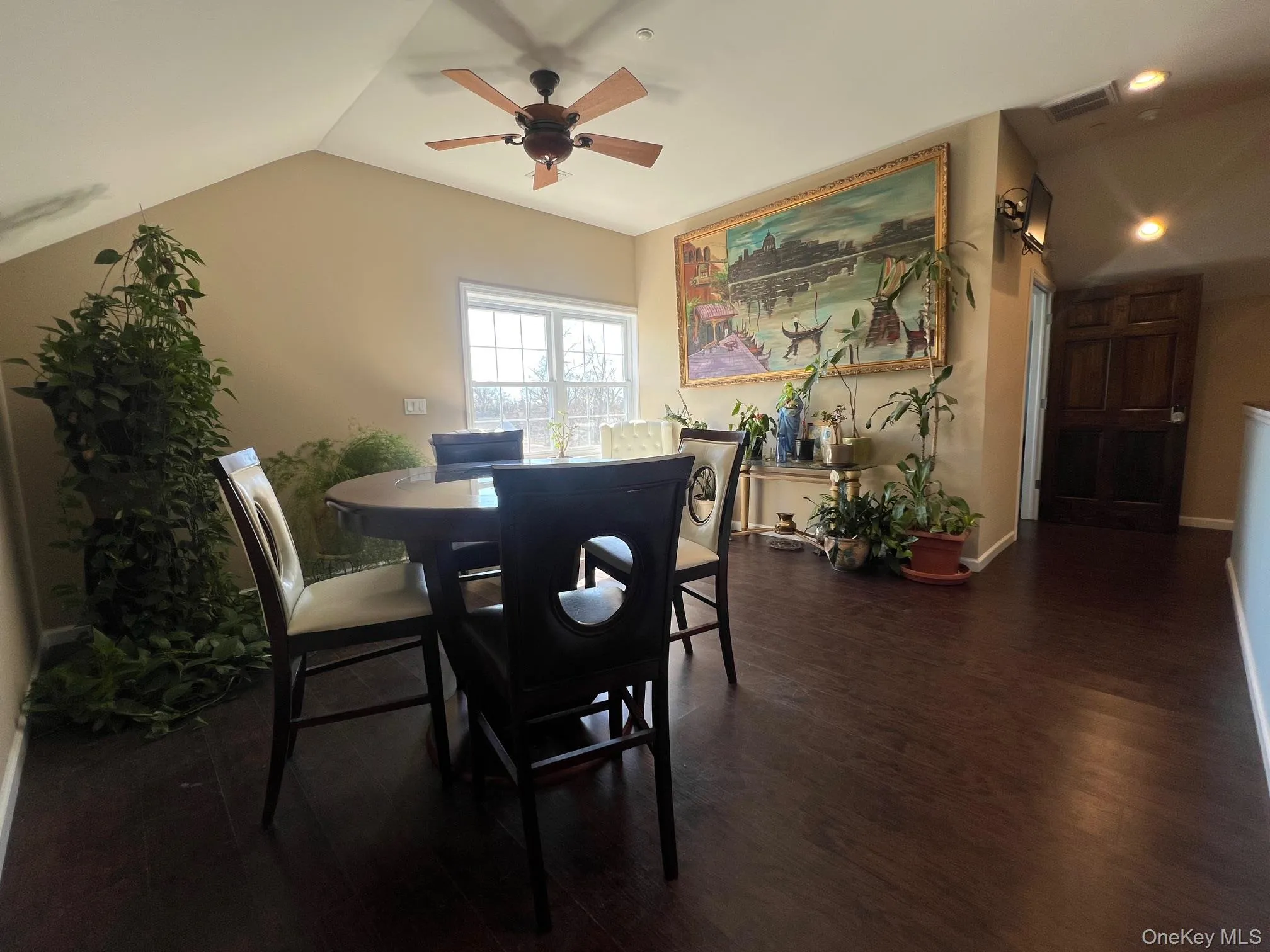 Smaller Conference space with a ceiling fan, dark wood finished floors, and lofted ceiling Smaller Conference space with a ceiling fan, dark wood finished floors, and lofted ceiling