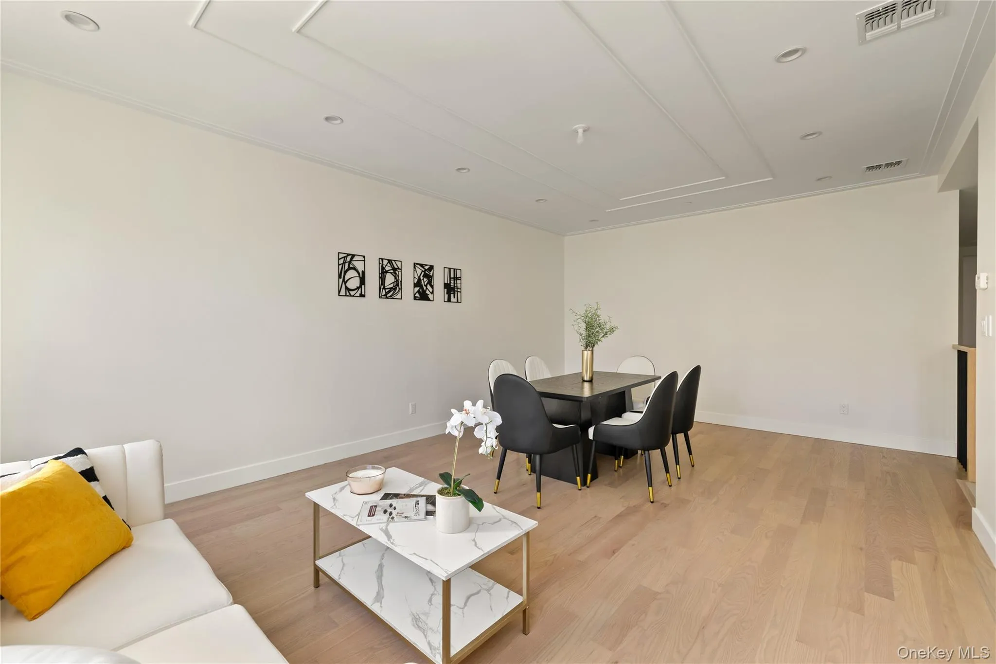 Living area featuring light wood finished floors and recessed lighting Living area featuring light wood finished floors and recessed lighting