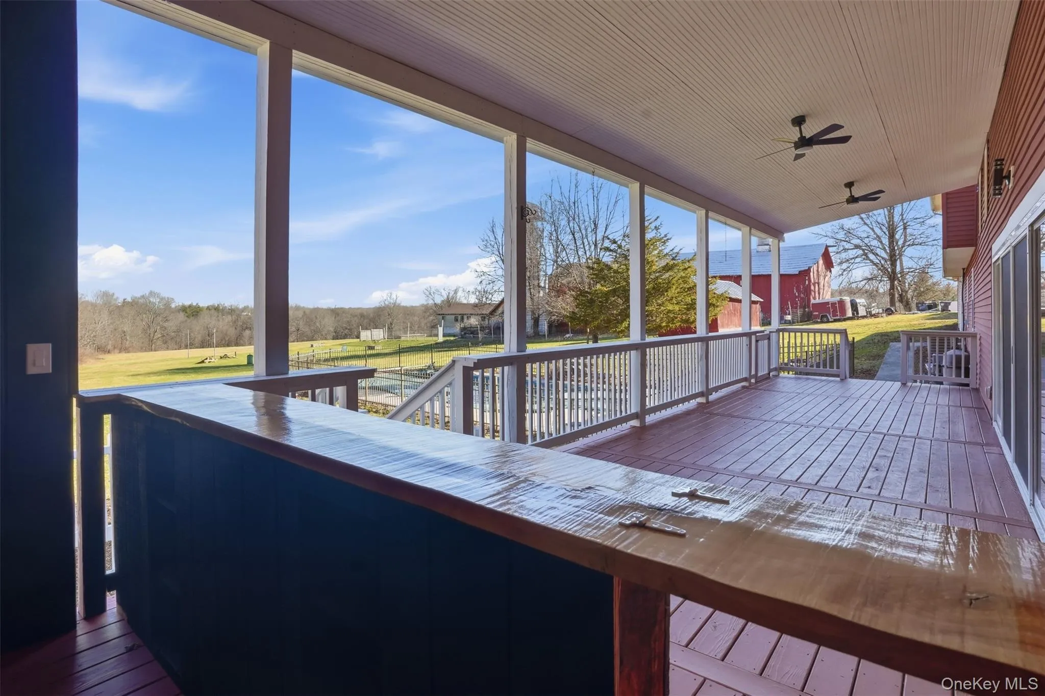 Expansive covered deck with custom bar Expansive covered deck with custom bar