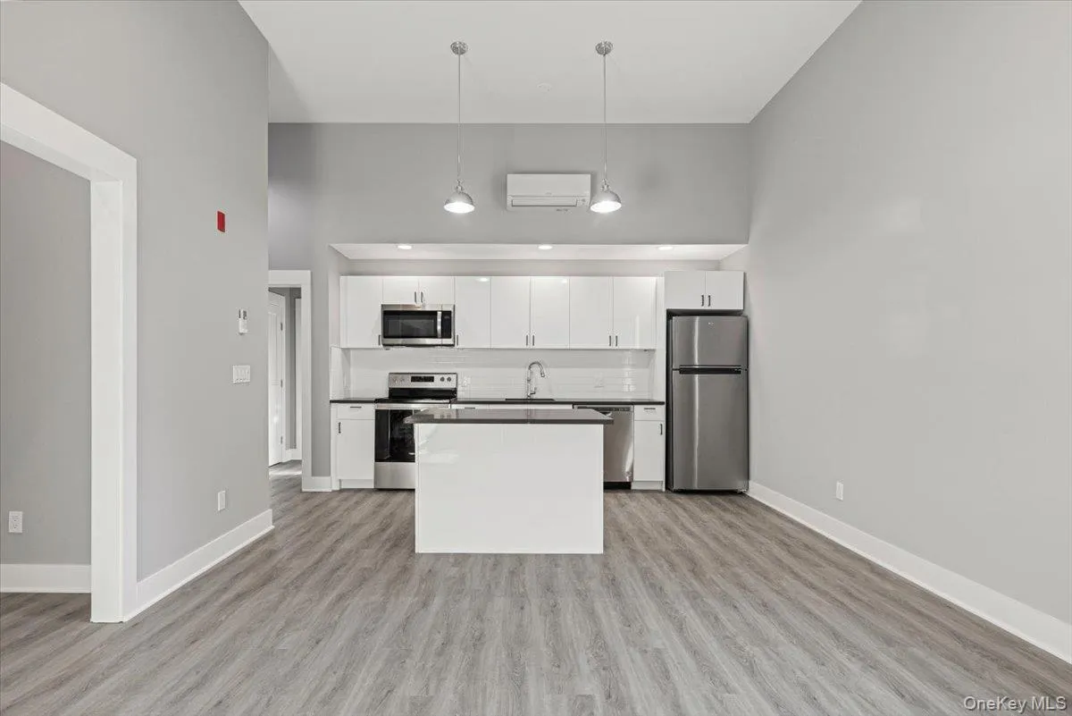 Seamless flow between kitchen, dining, and living areas. Seamless flow between kitchen, dining, and living areas.