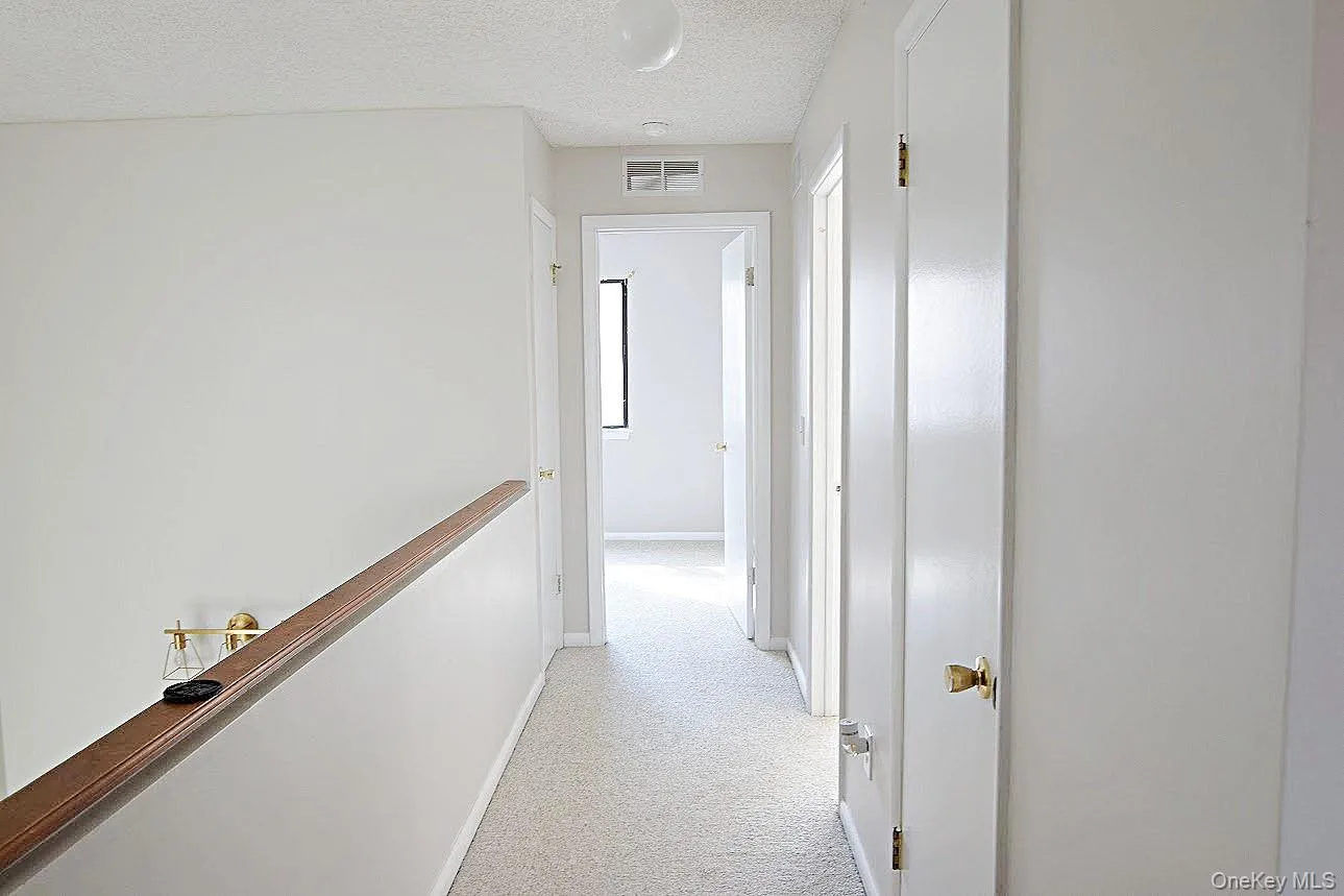 Enter the hallway from a staircase. The hall closet and laundry closet are located here. Enter the hallway from a staircase. The hall closet and laundry closet are located here.