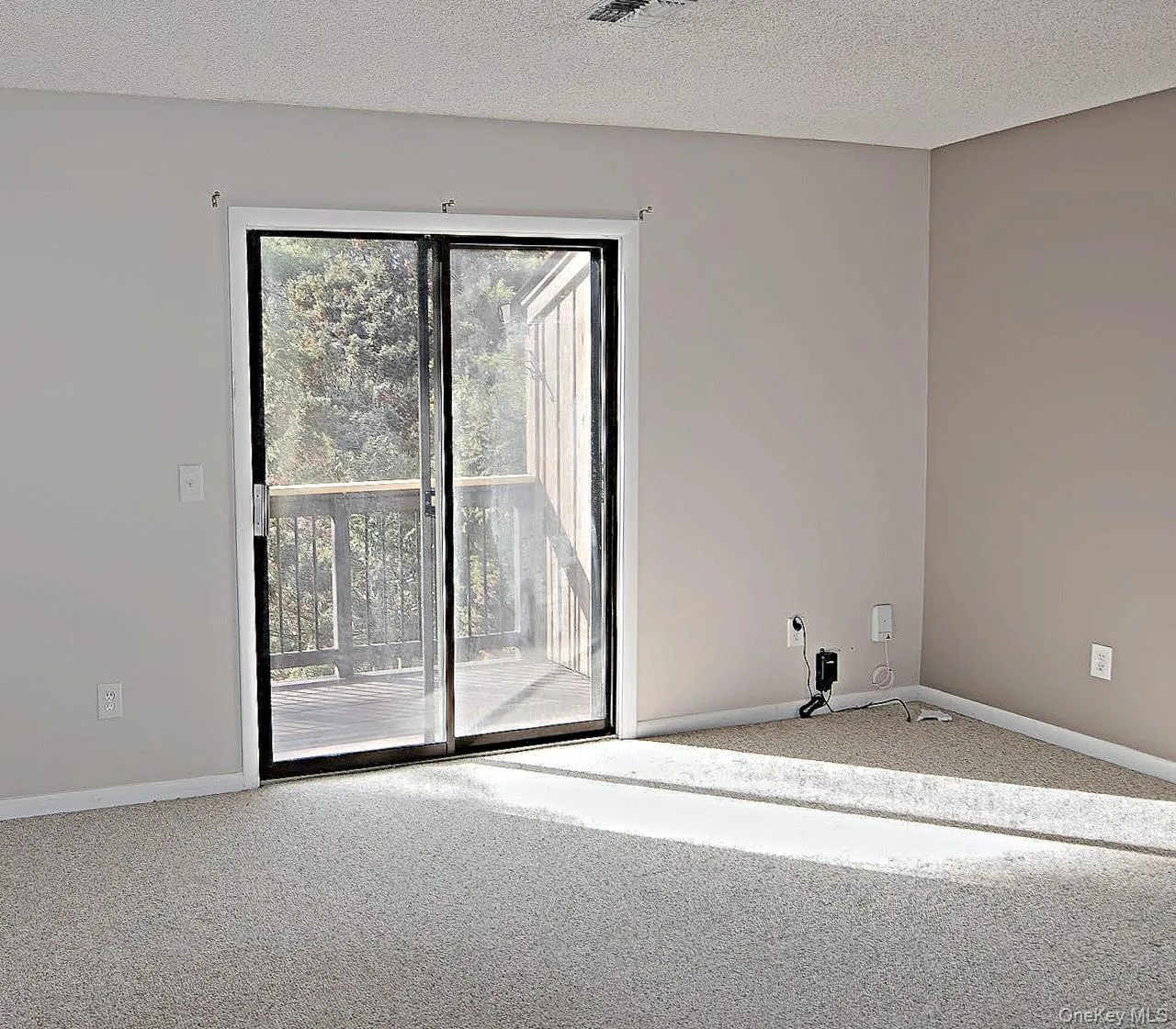 The door in this bedroom leads to a balcony The door in this bedroom leads to a balcony