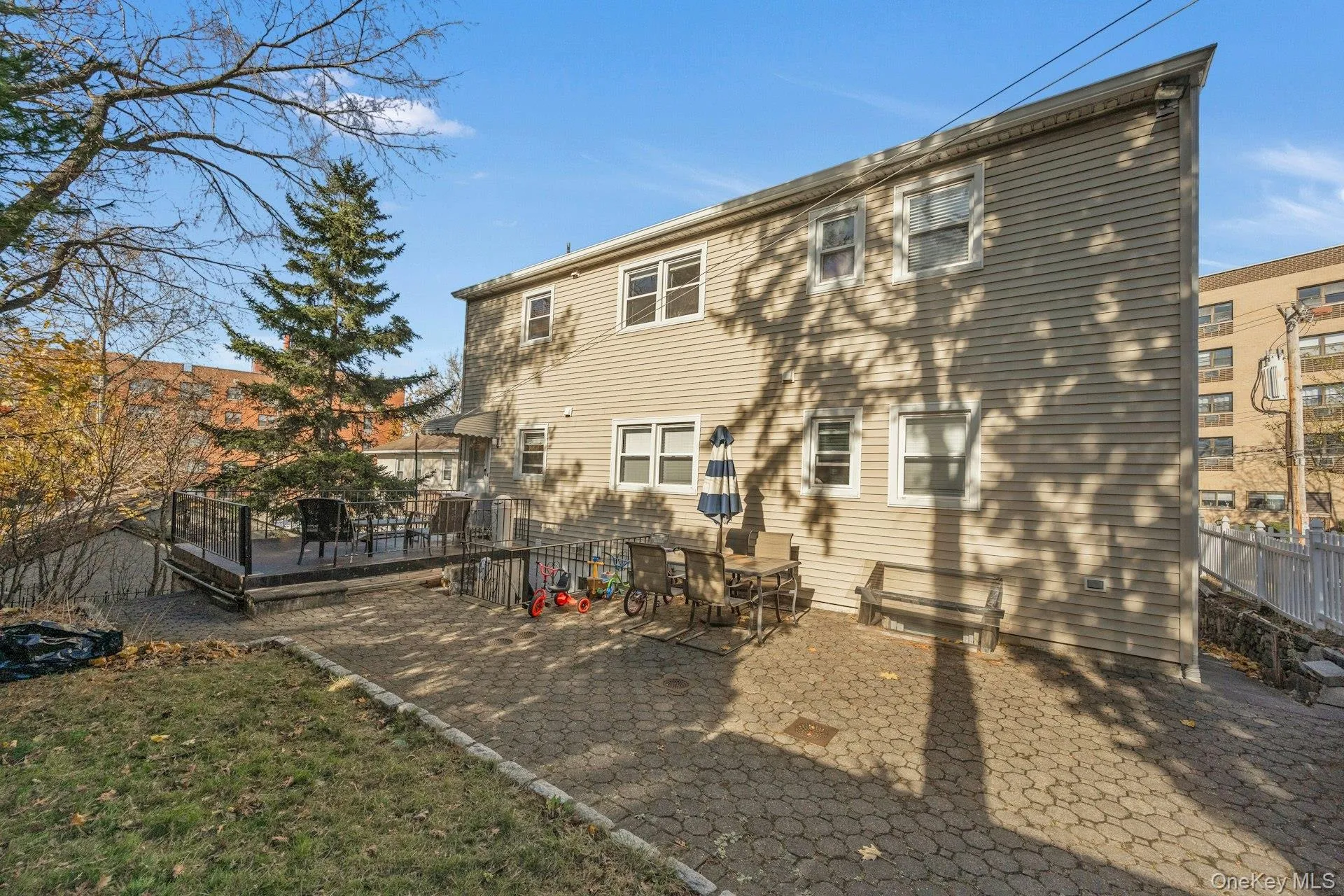 Rear view of property with a patio area Rear view of property with a patio area