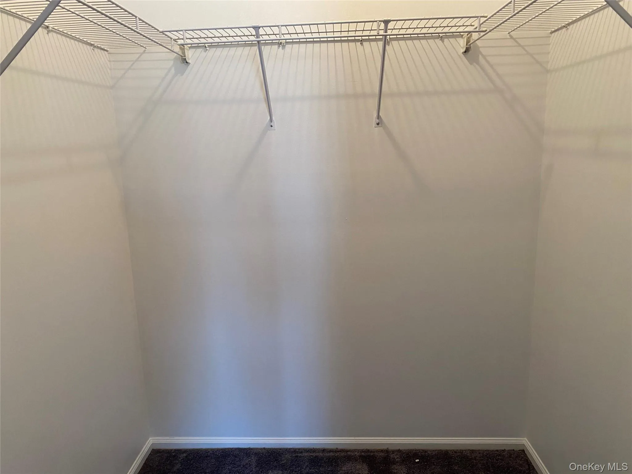 Walk in closet in master bedroom Walk in closet in master bedroom